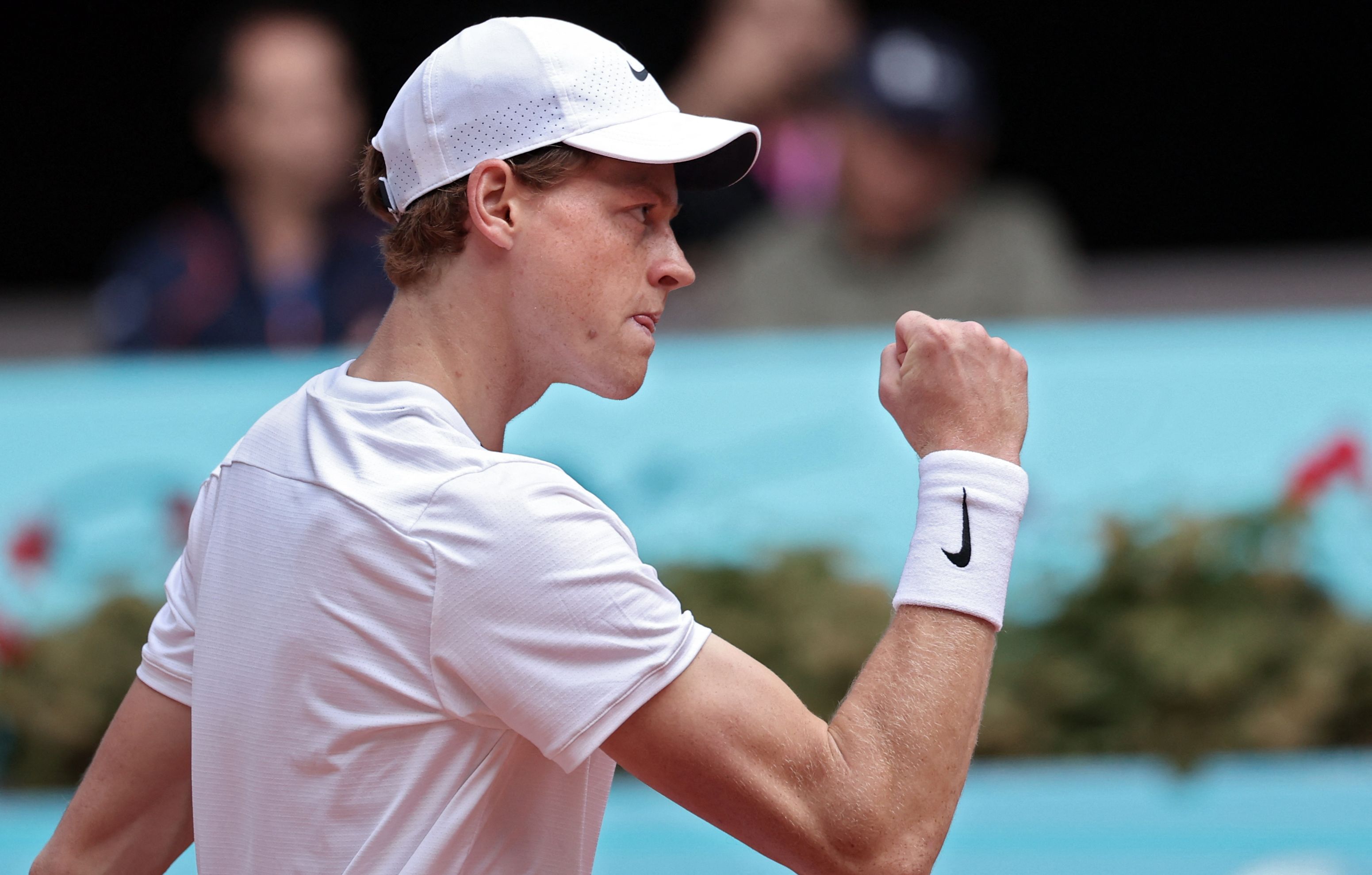 Italy's Jannik Sinner gestures as he plays against Russia's Karen Khachanov during the fourth round of the 2024 ATP Tour Madrid Open tournament tennis match at Caja Magica in Madrid on April 30, 2024. (Photo by Thomas COEX / AFP)