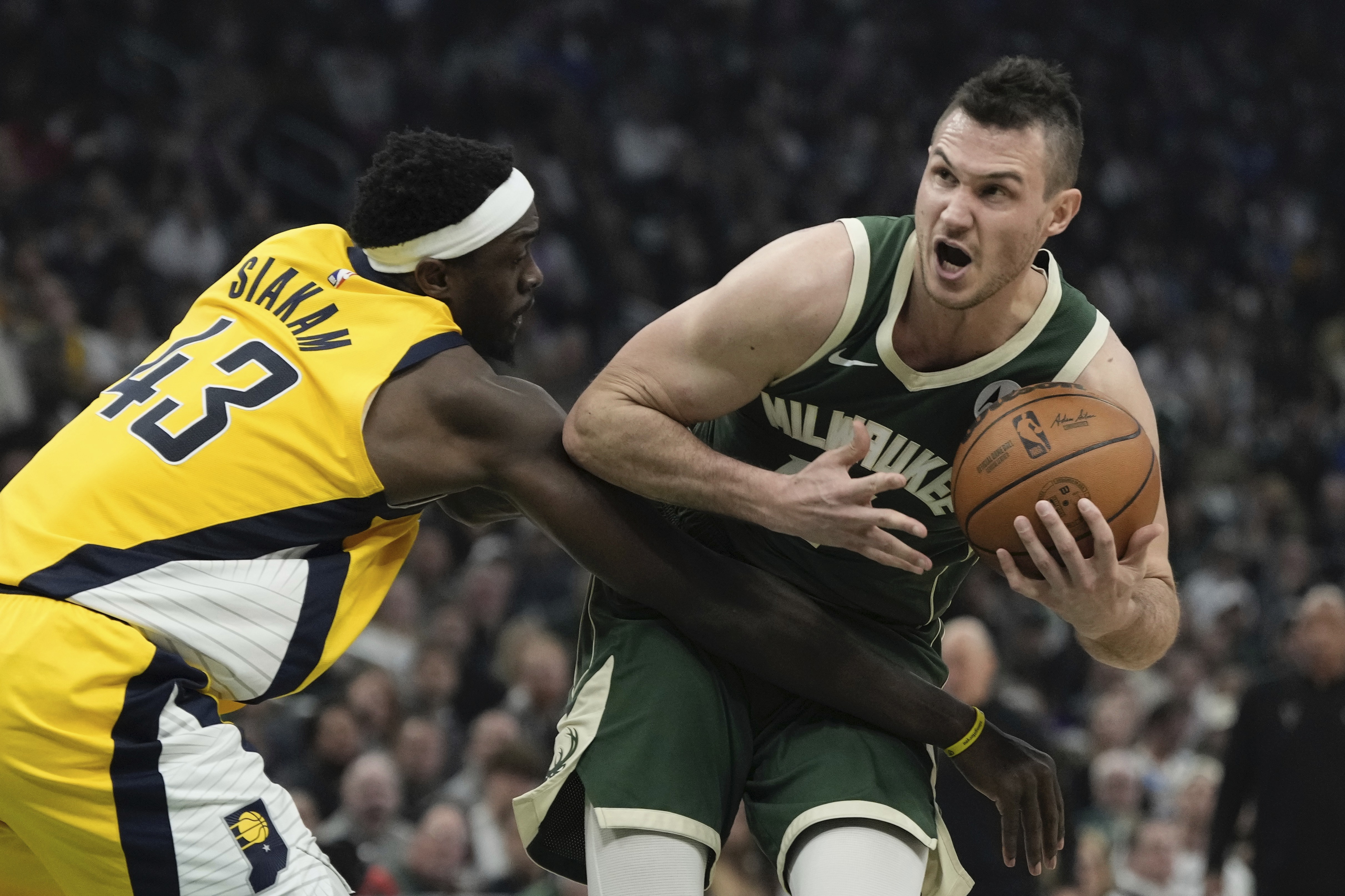 Indiana Pacers' Pascal Siakam fouls Milwaukee Bucks' Danilo Gallinari during the first half of Game 5 of the NBA playoff basketball series Tuesday, April 30, 2024, in Milwaukee. (AP Photo/Morry Gash)
