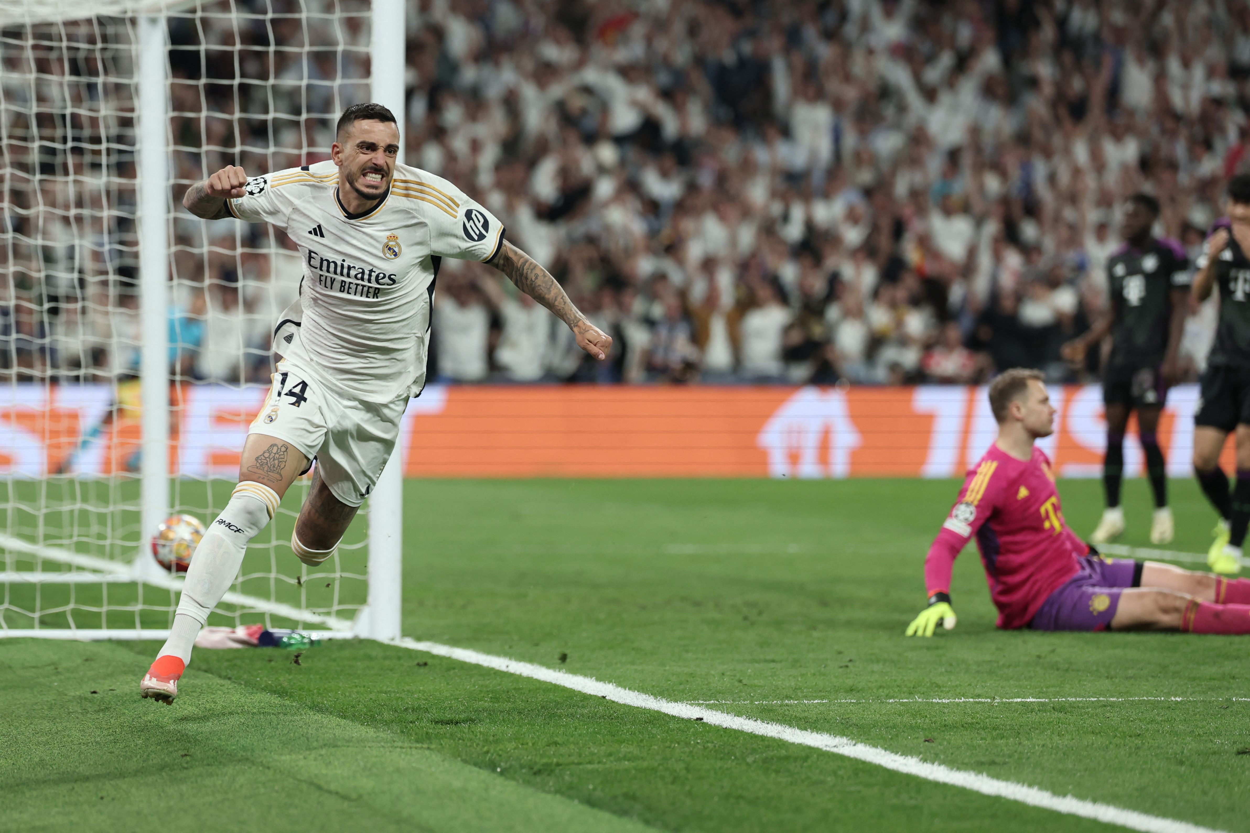 TOPSHOT - Real Madrid's Spanish forward #14 Joselu celebrates scoring his team's first goal during the UEFA Champions League semi final second leg football match between Real Madrid CF and FC Bayern Munich at the Santiago Bernabeu stadium in Madrid on May 8, 2024. (Photo by Thomas COEX / AFP)
