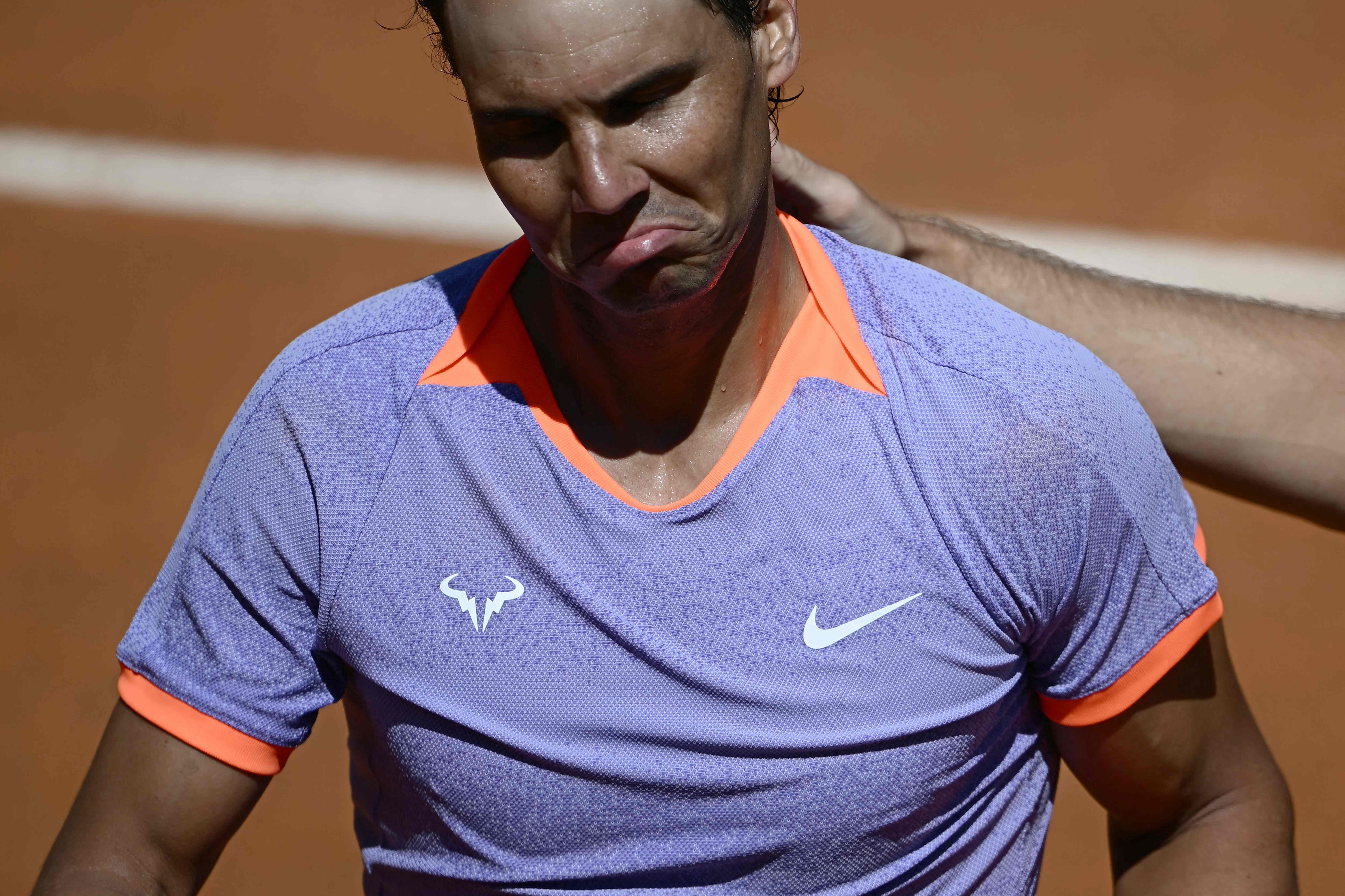 Spain's Rafael Nadal looks dejected after being eliminated by Poland's Hubert Hurkacz during the Men's ATP Rome Open tennis tournament at Foro Italico in Rome on May 11, 2024. (Photo by Filippo MONTEFORTE / AFP)