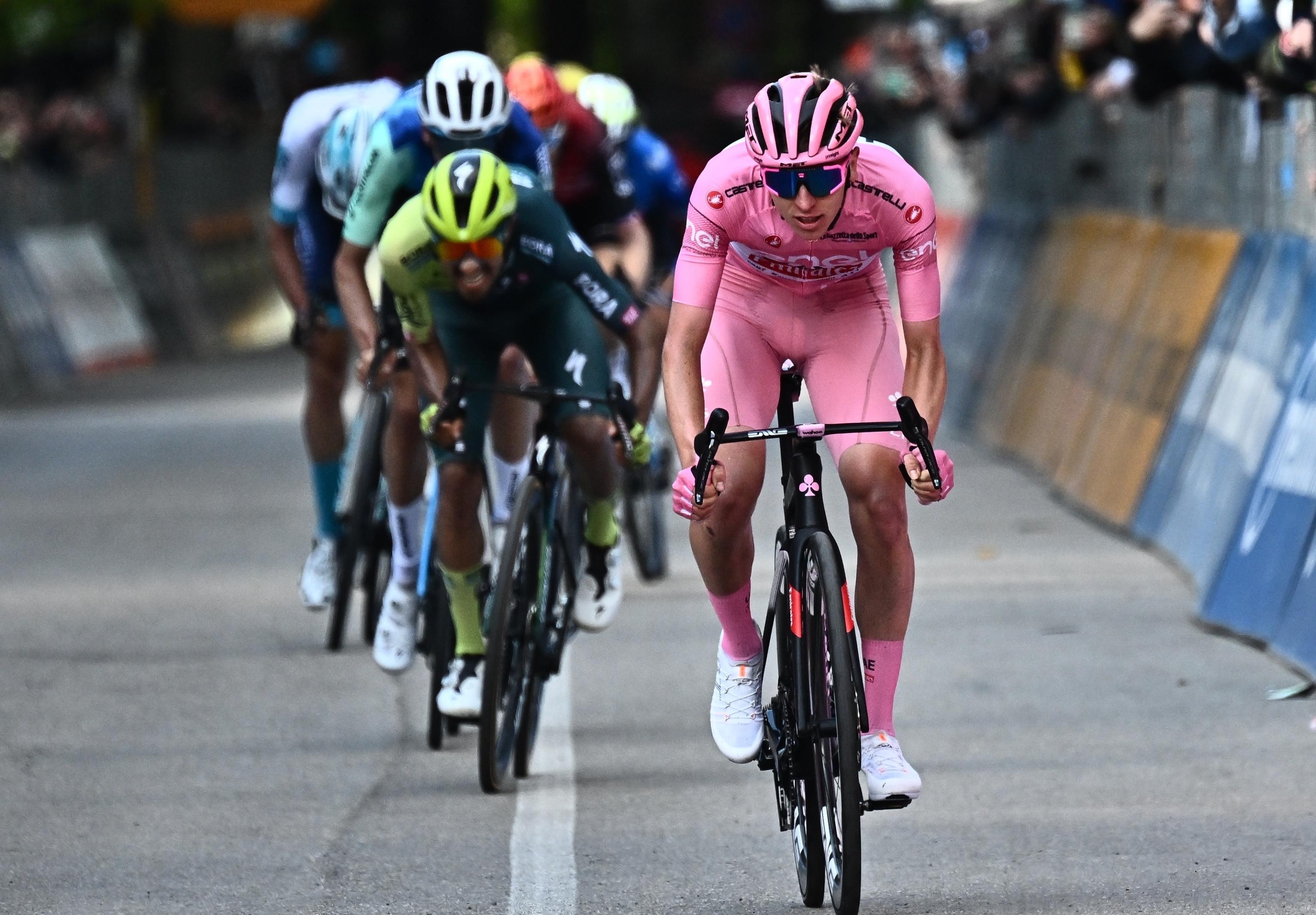 Slovenian rider Tadej Pogacar of  team Uae Emirates wearing the overall leader's pink jersey, in action to cross  the finish line and win the 8th stage of the 107 Giro d'Italia 2024, cycling race over 152 km from Spoleto to Prati di Tivo, Italy, 11 May 2024. ANSA/LUCA ZENNARO