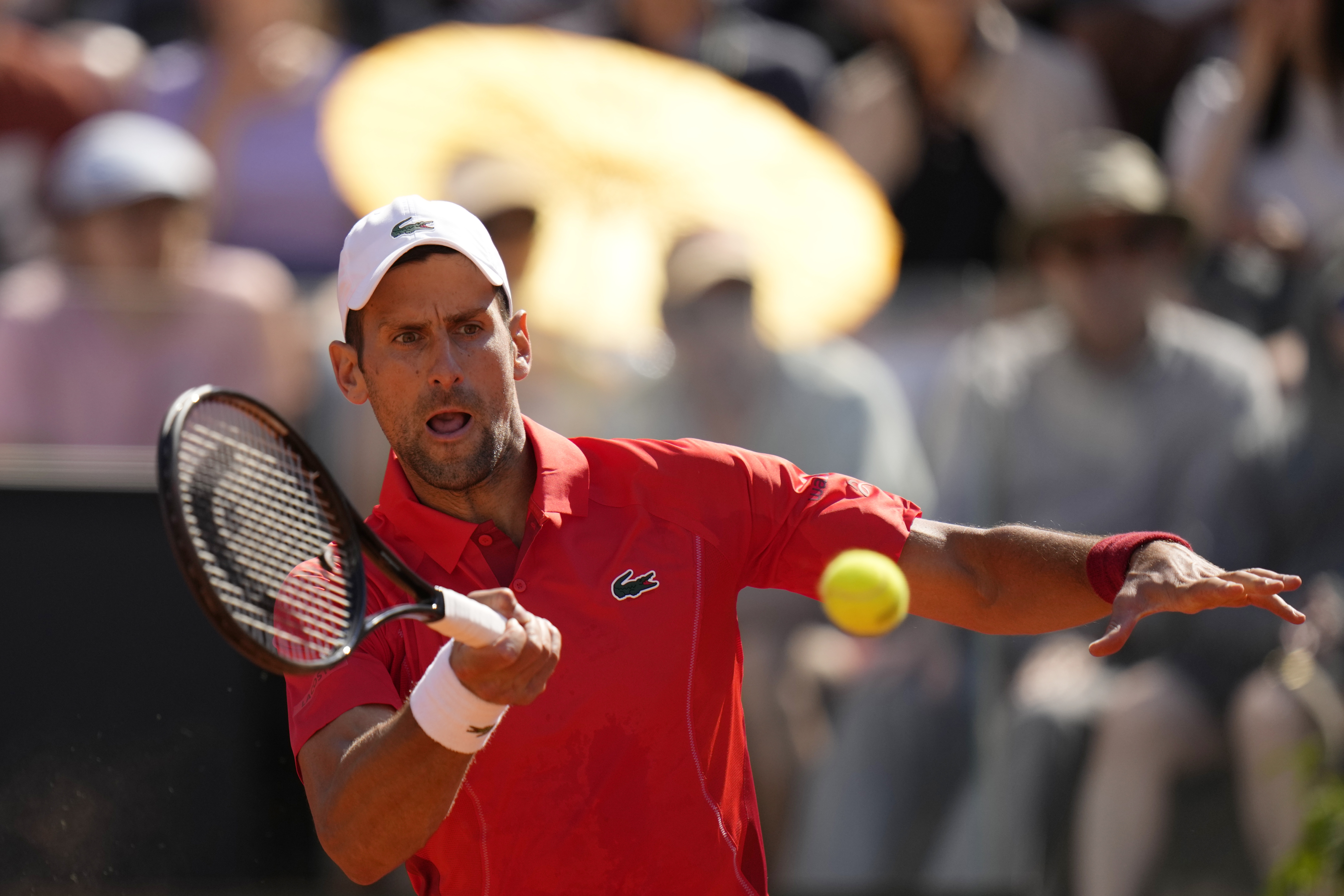 Serbia's Novak Djokovic returns the ball to Chile's Alejandro Tabilo at the Italian Open tennis tournament in Rome, Sunday, May 12, 2024. (AP Photo/Alessandra Tarantino)