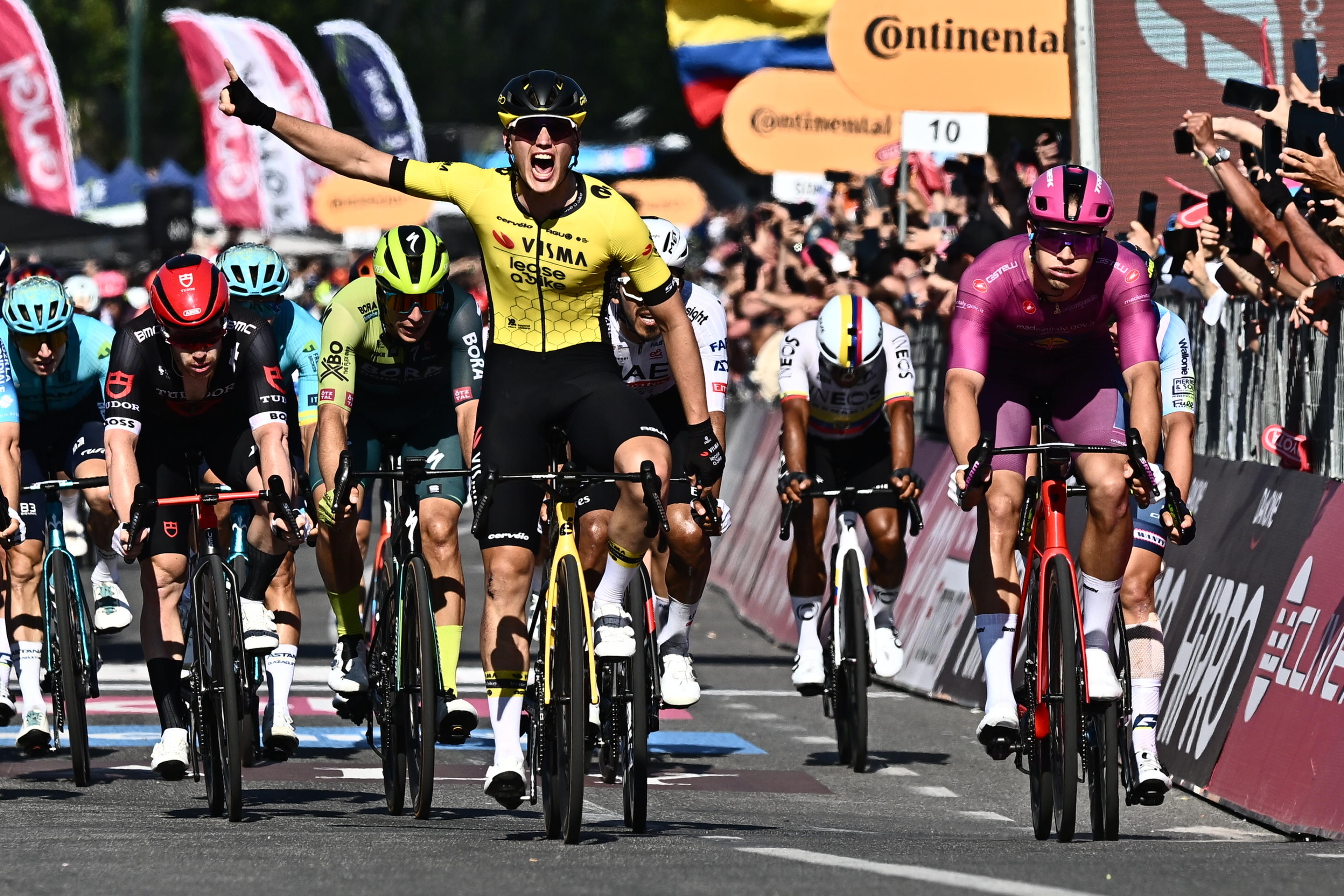 Dutch rider Olav Kooij of Team Visma Lease a Bike&nbsp; celebrates after crossing the finish line and win the 9th stage of the 107 Giro d'Italia 2024, cycling race over 214 km from Avezzano to Napoli, Italy, 12 May 2024. ANSA/LUCA ZENNARO