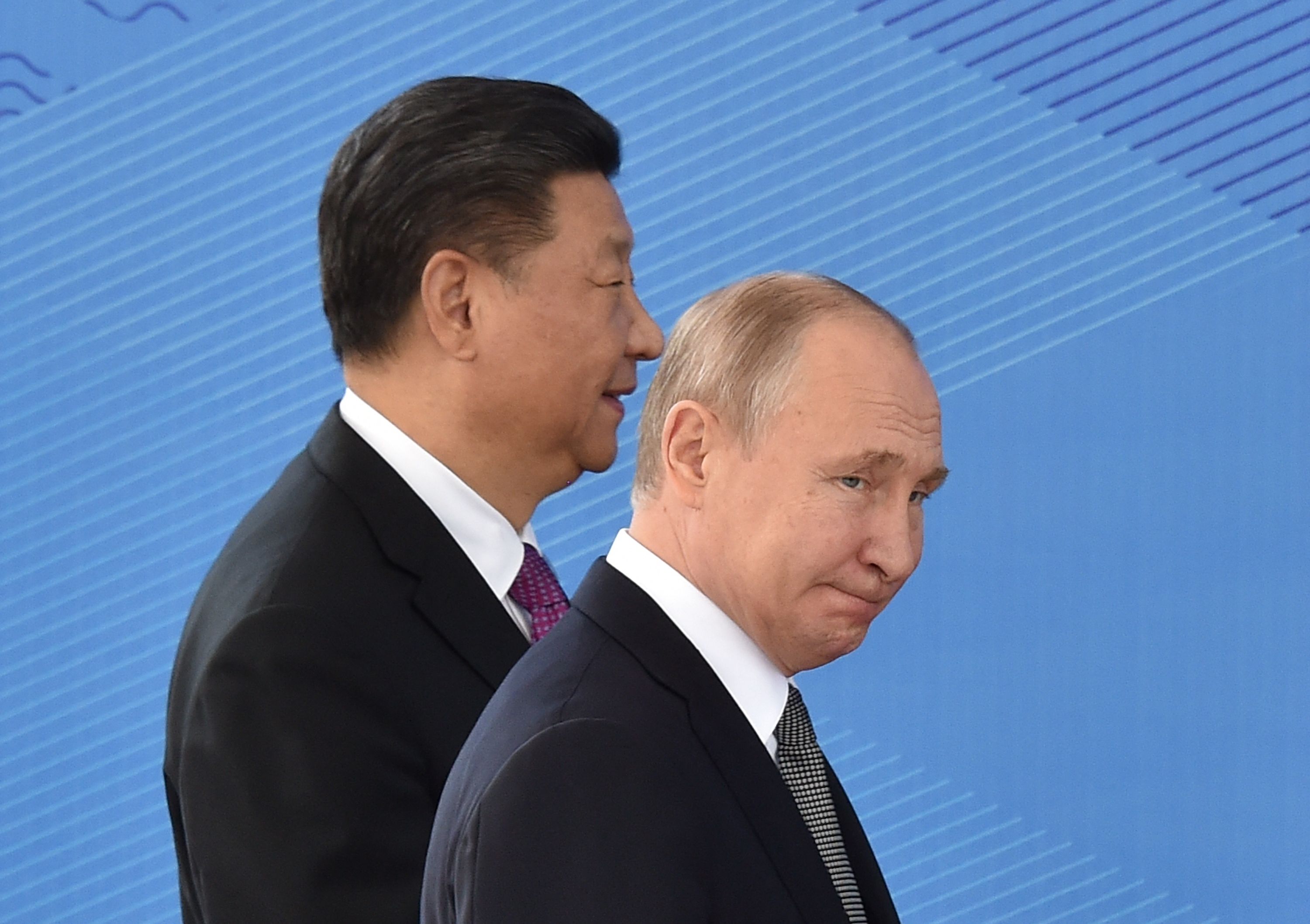 (FILES) Russia's President Vladimir Putin and China's President Xi Jinping walk as they attend a meeting of the Shanghai Cooperation Organisation (SCO) Council of Heads of State in Bishkek on June 14, 2019. Russian President Vladimir Putin will visit China this week on the invitation of leader Xi Jinping, Beijing's foreign ministry said May 14, 2024. (Photo by Vyacheslav OSELEDKO / AFP)