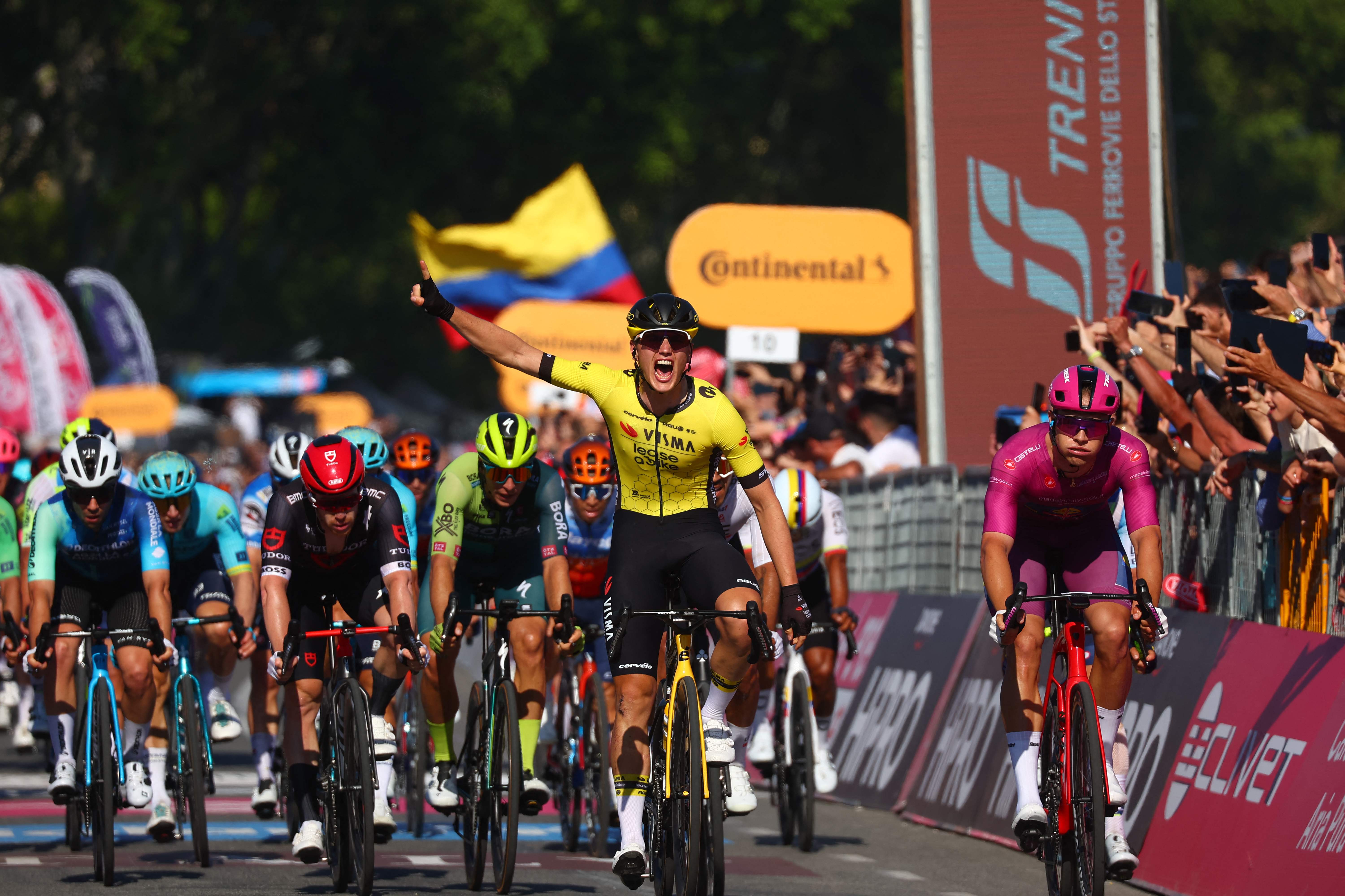 Team VismaLease a Bike's Dutch rider Olav Kooij celebrates after winning the 9th stage of the 107th Giro d'Italia cycling race, 214km between Avezzano and Naples, on May 12, 2024. (Photo by Luca Bettini / AFP)