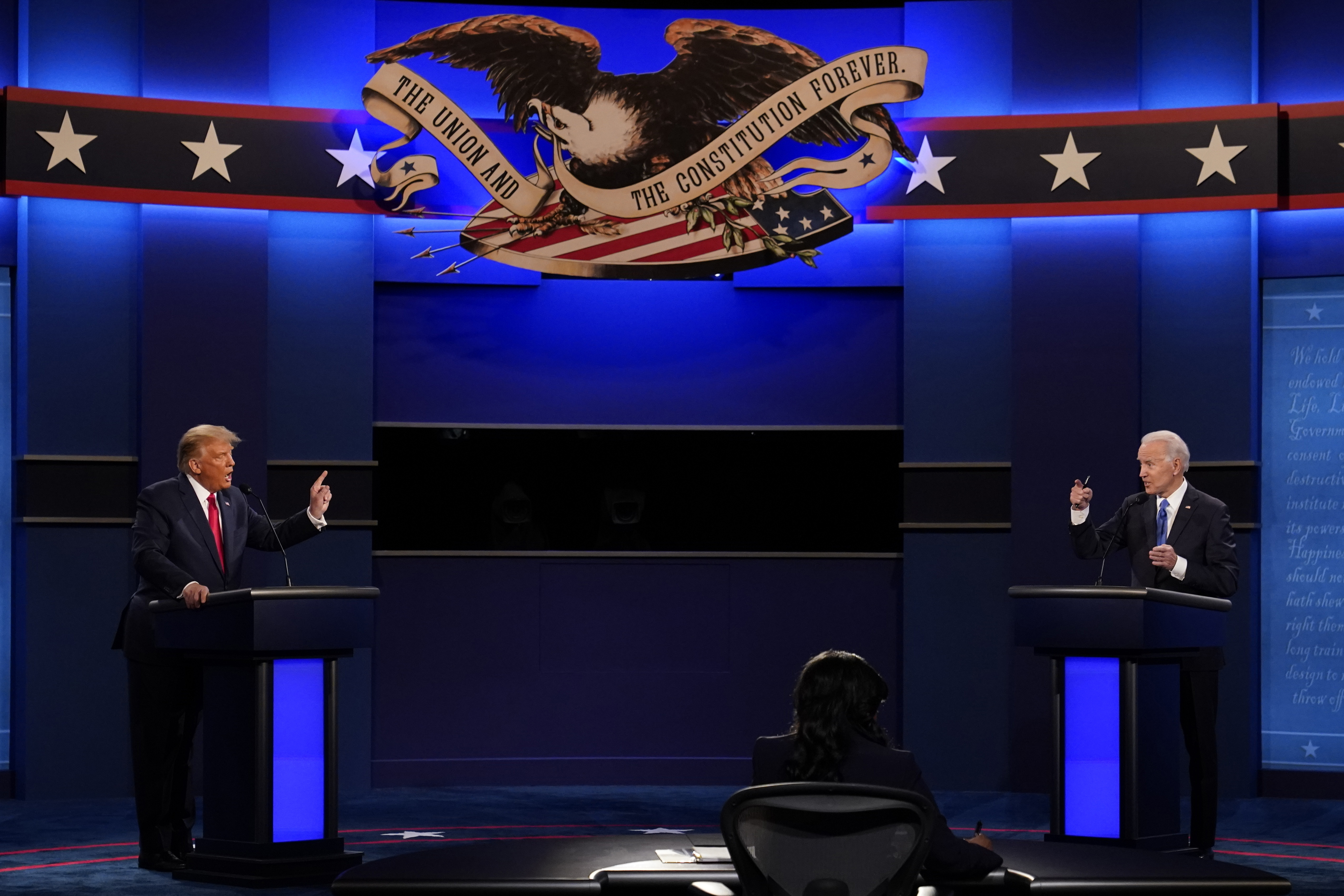 FILE - President Donald Trump, left, and Democratic presidential candidate former Vice President Joe Biden speak during the debate at Belmont University in Nashville, Tenn. on Oct. 22, 2020. President Joe Biden and Trump have agreed to participate in two general election debates: One in June and one in September. (AP Photo/Patrick Semansky, File)