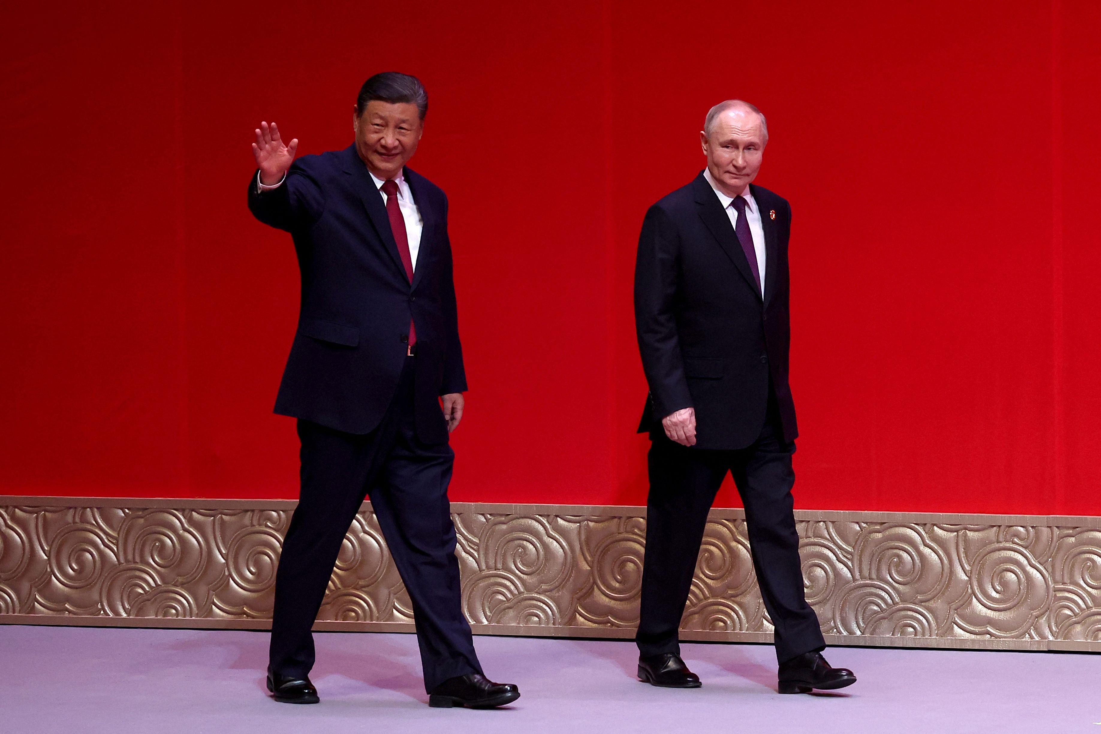 In this pool photograph distributed by the Russian state agency Sputnik, Russia's President Vladimir Putin and China's President Xi Jinping attend a concert marking the 75th anniversary of the establishment of diplomatic relations between Russia and China and opening of China-Russia Years of Culture at the National Centre for the Performing Arts in Beijing on May 16, 2024. (Photo by Alexander RYUMIN / POOL / AFP) / ** Editor's note : this image is distributed by Russian state owned agency Sputnik **