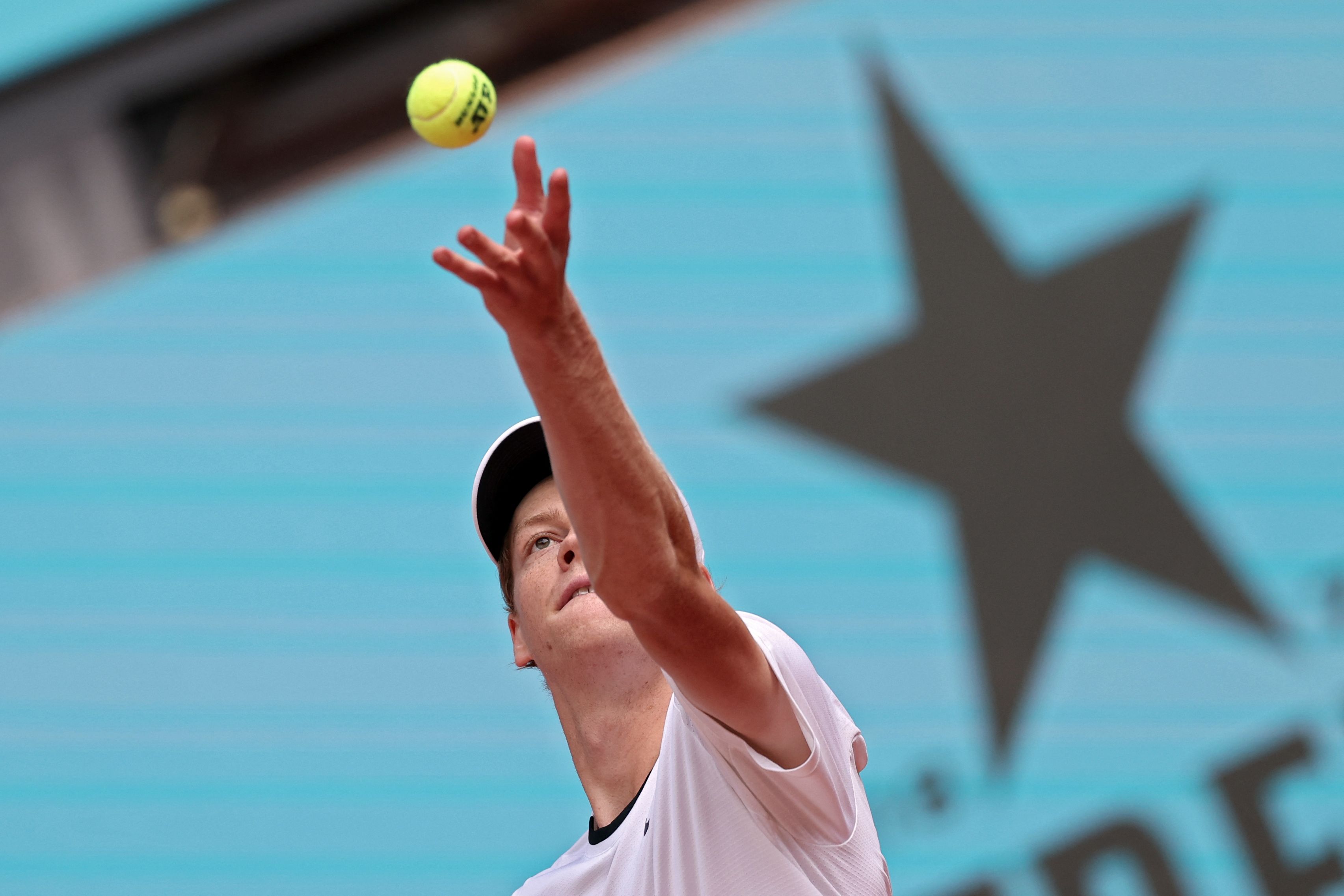 Italy's Jannik Sinner serves the ball to Russia's Karen Khachanov during the fourth round of the 2024 ATP Tour Madrid Open tournament tennis match at Caja Magica in Madrid on April 30, 2024. (Photo by Thomas COEX / AFP)