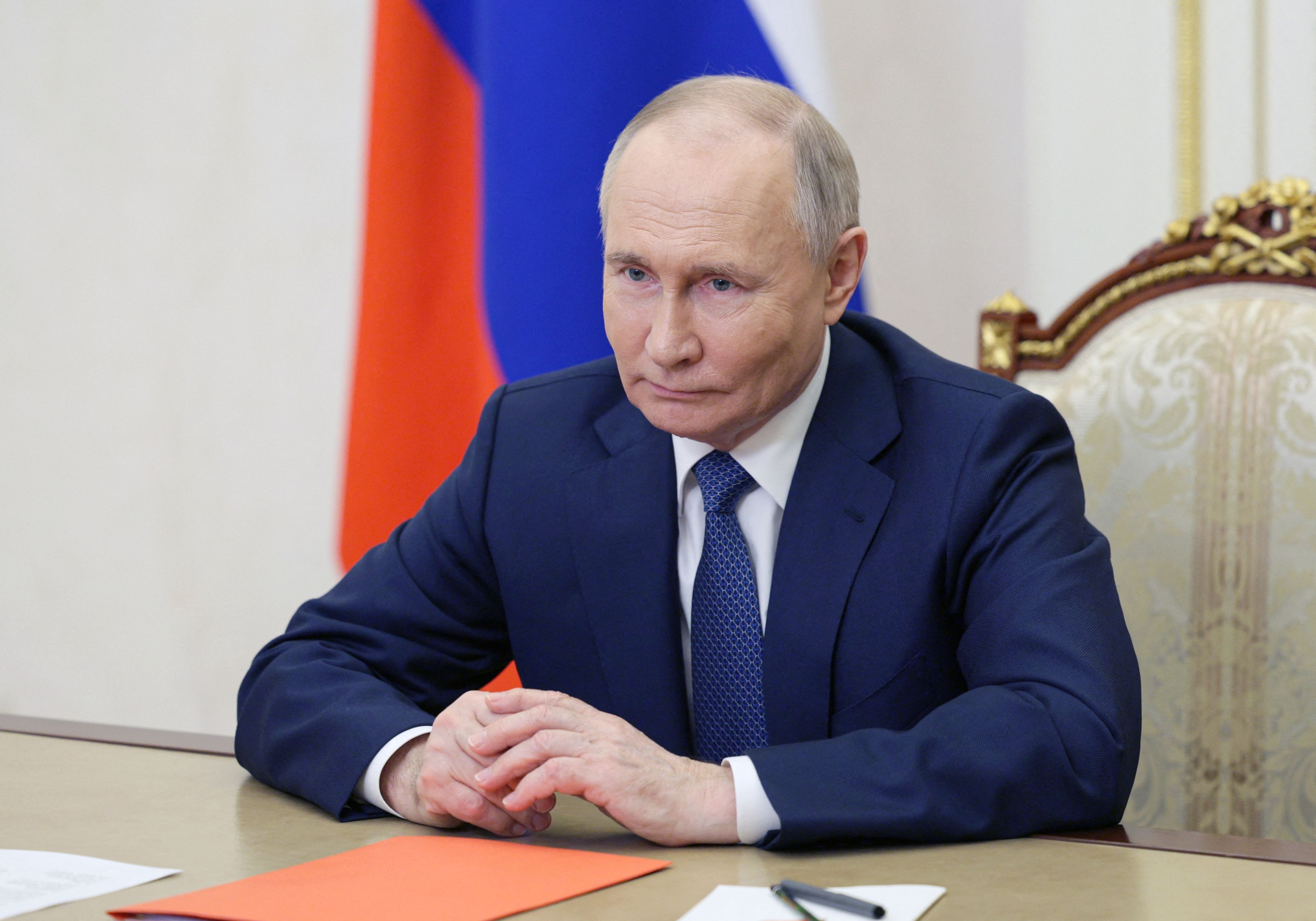 TOPSHOT - In this pool photograph distributed by Russia's state agency Sputnik, Russian President Vladimir Putin chairs a Security Council meeting via a videoconference in Moscow on May 13, 2024. (Photo by Alexei Babushkin / POOL / AFP)