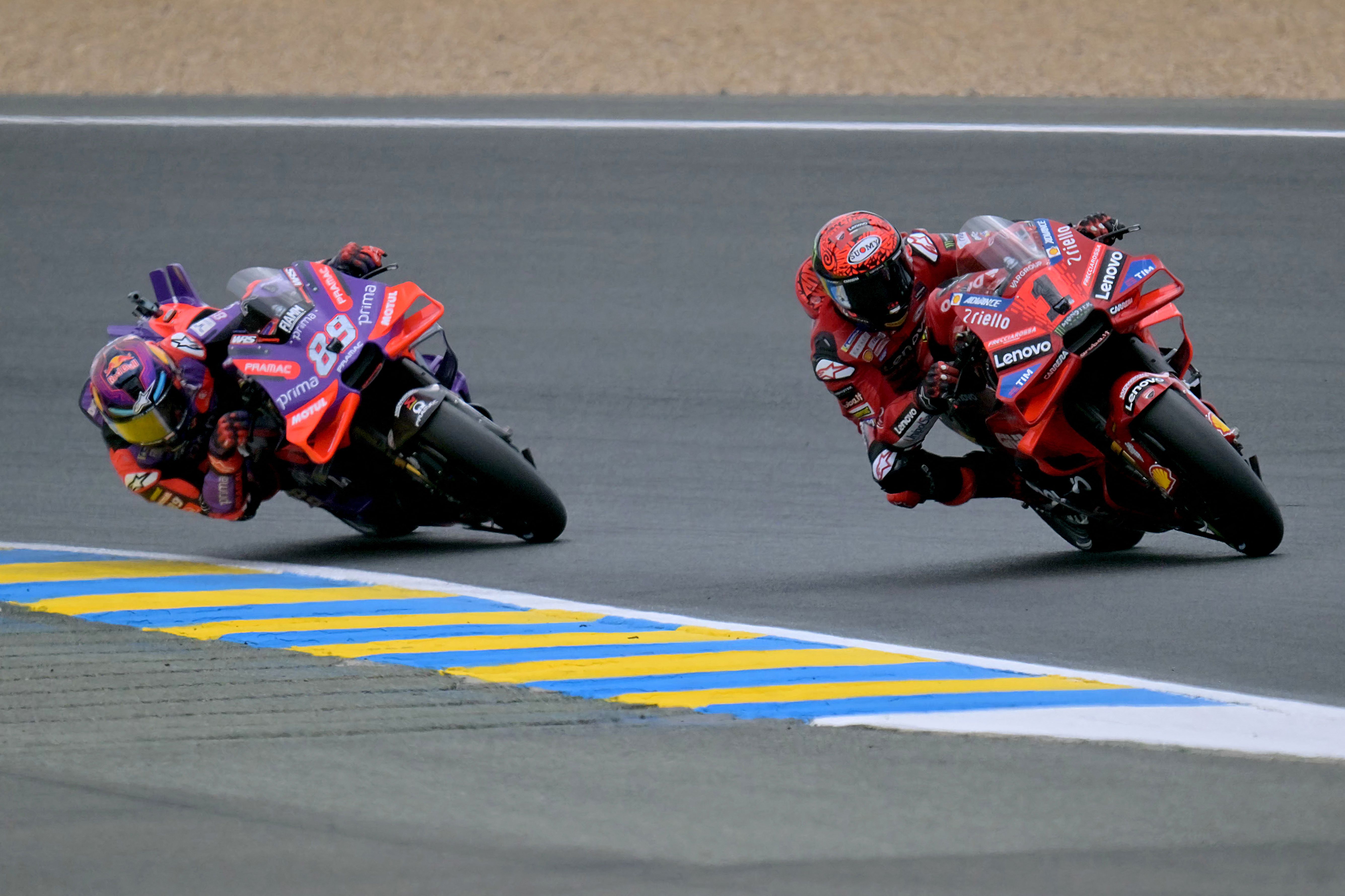 Prima Pramac Racing's Spanish rider Jorge Martin (L) and Ducati Lenovo Team's Italian rider Francesco Bagnaia Prima Pramac Racing's Spanish rider Jorge Martin (L) and Ducati Lenovo Team's Italian rider Francesco Bagnaia compete during the French MotoGP Grand Prix race at the Bugatti circuit in Le Mans, northwestern France, on May 12, 2024. (Photo by LOU BENOIST / AFP)