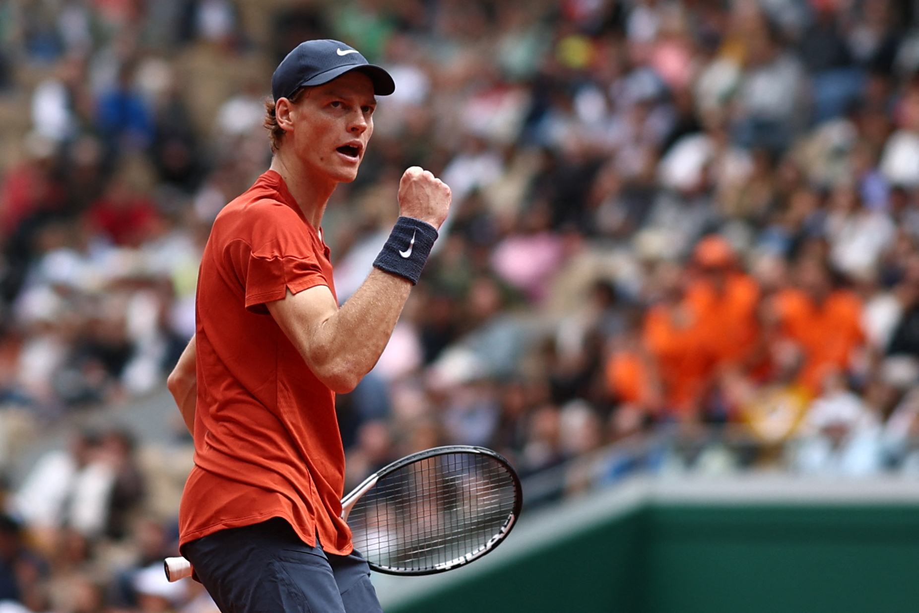 Italy's Jannik Sinner reacts after a point during his men's singles match against US Christopher Eubanks on Court Suzanne-Lenglen on day two of the French Open tennis tournament at the Roland Garros Complex in Paris on May 27, 2024. (Photo by Anne-Christine POUJOULAT / AFP)
