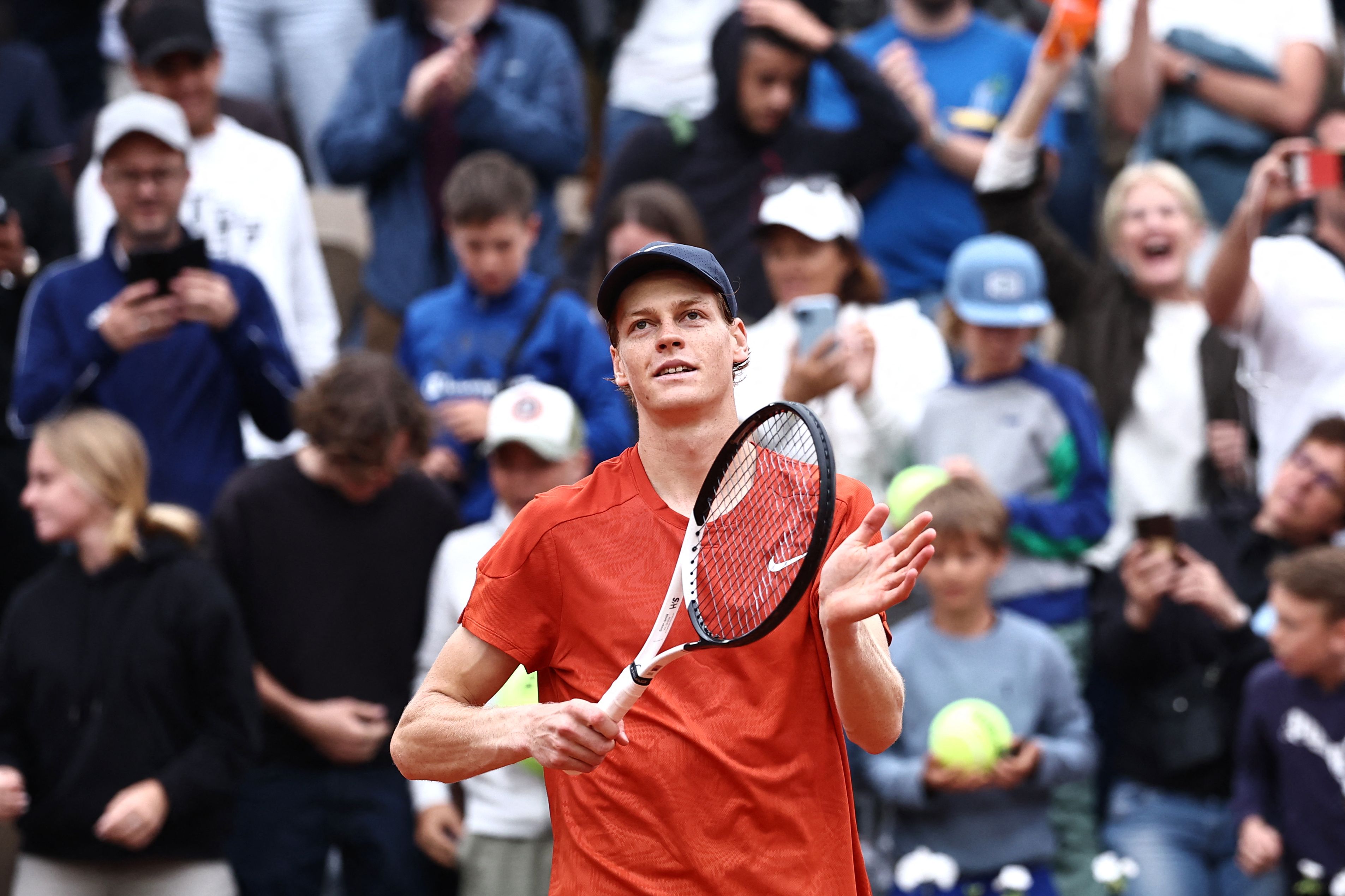 Italy's Jannik Sinner celebrates after winning his men's singles match against US Christopher Eubanks on Court Suzanne-Lenglen on day two of the French Open tennis tournament at the Roland Garros Complex in Paris on May 27, 2024. (Photo by Anne-Christine POUJOULAT / AFP)