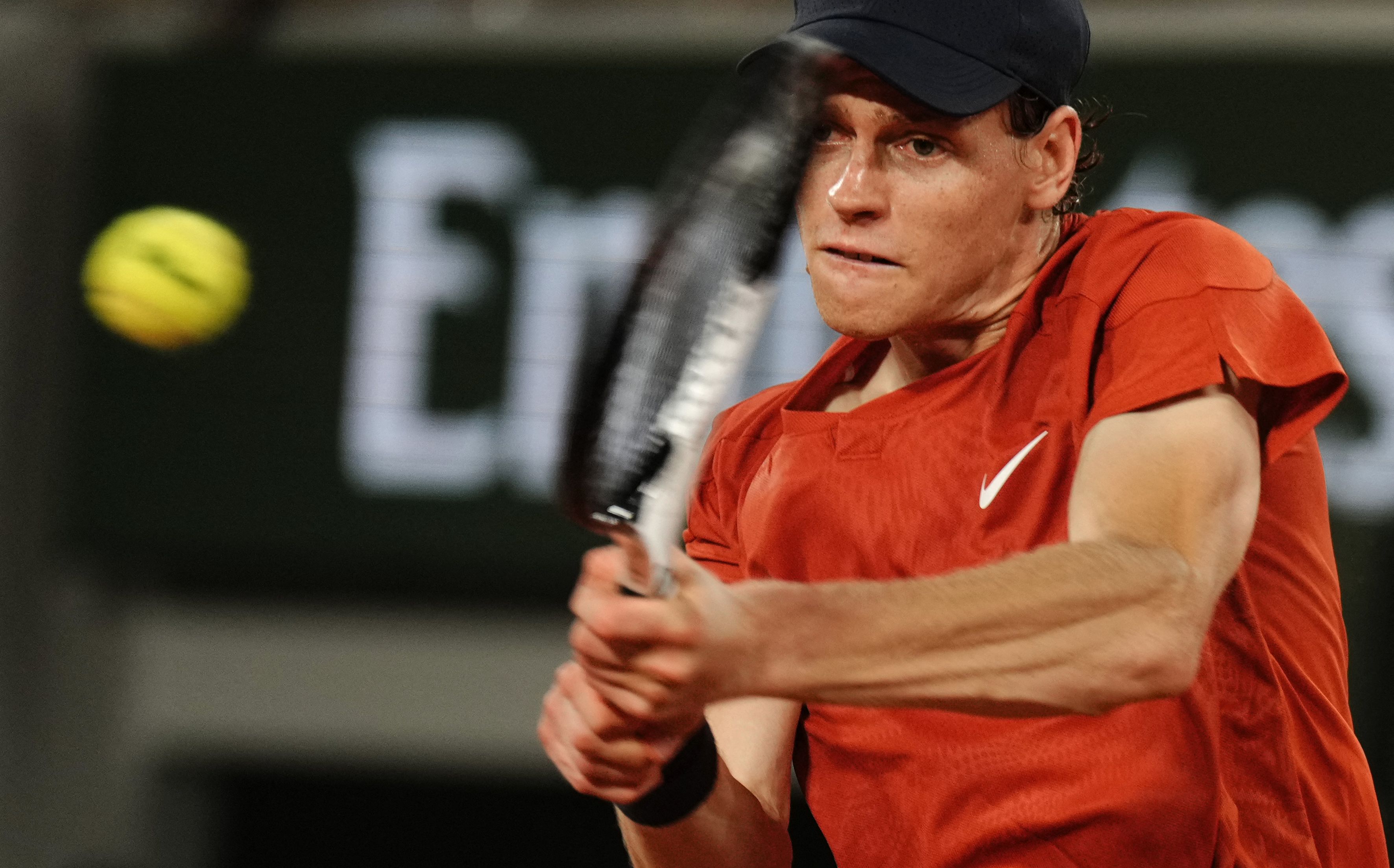 Italy's Jannik Sinner plays a backhand return to France's Richard Gasquet during their men's singles match on Court Philippe-Chatrier on day four of the French Open tennis tournament at the Roland Garros Complex in Paris on May 29, 2024. (Photo by Dimitar DILKOFF / AFP)