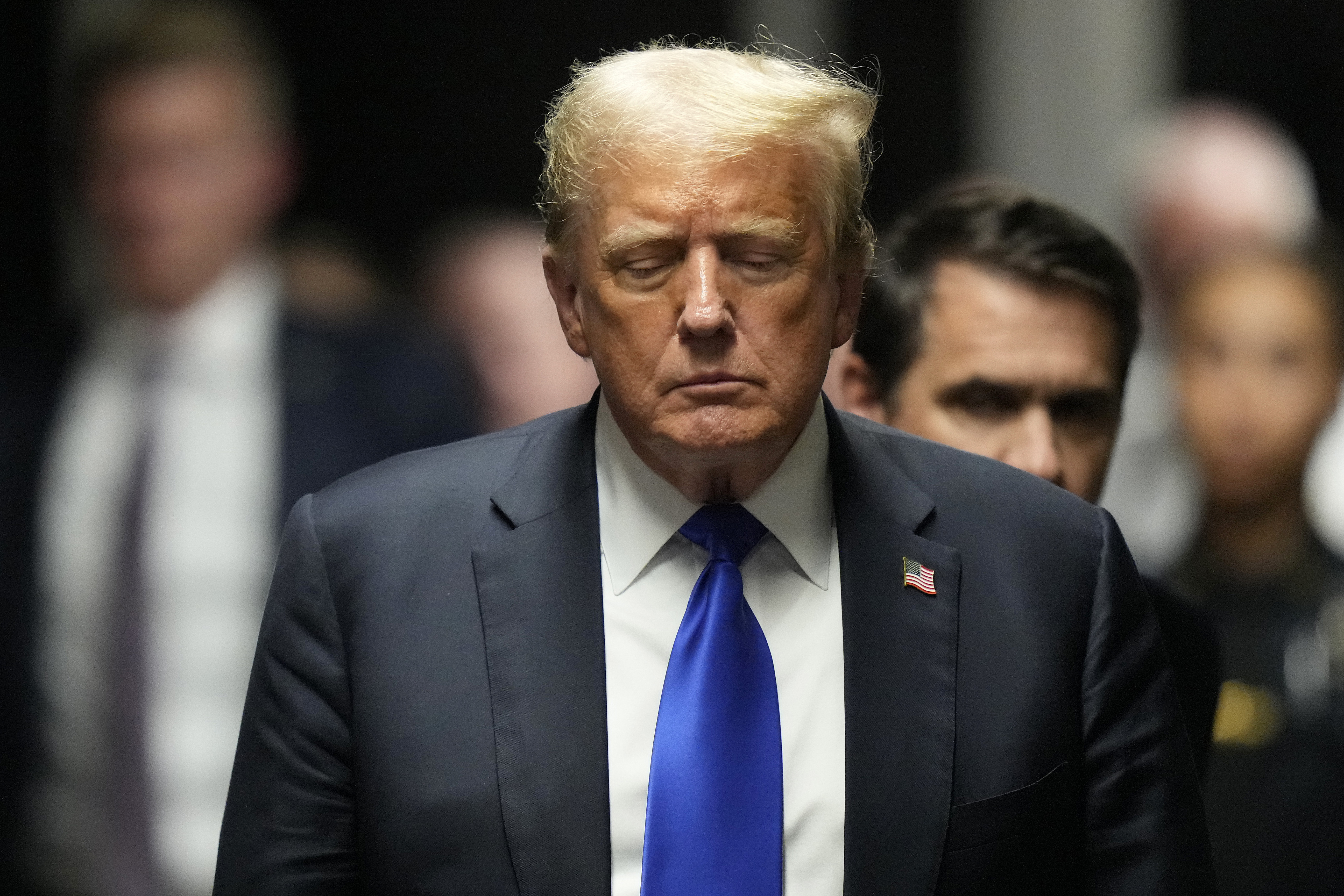 Former President Donald Trump walks to make comments to members of the media after a jury convicted him of felony crimes for falsifying business records in a scheme to illegally influence the 2016 election, at Manhattan Criminal Court, Thursday, May 30, 2024, in New York. (AP Photo/Seth Wenig, Pool)