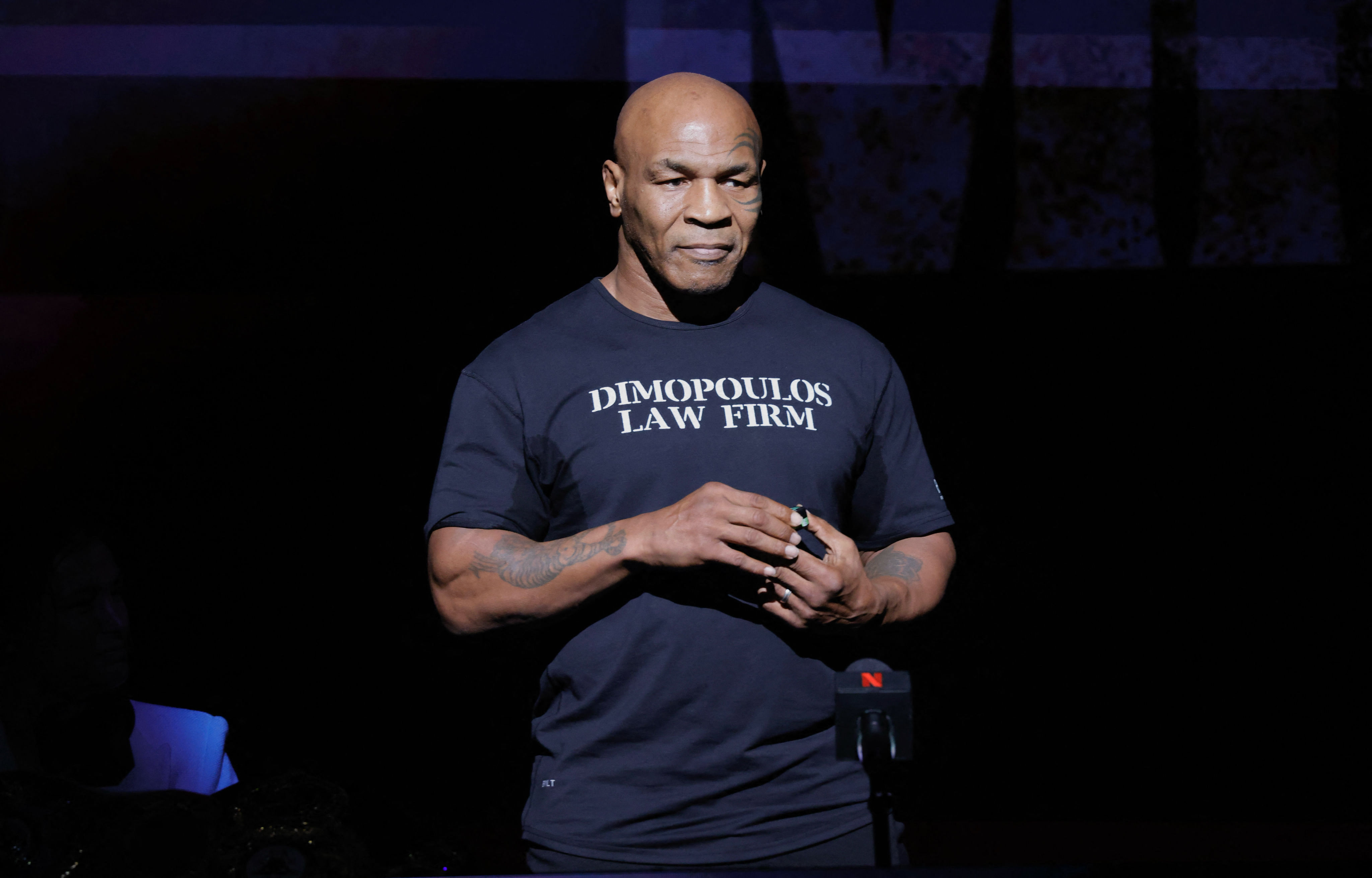 (FILES) Former US boxer Mike Tyson speaks at a press conference at the Apollo Theatre in New York, on May 13, 2024. Mike Tyson's upcoming return to the ring against YouTuber Jake Paul has been postponed after the former heavyweight champion's recent health scare, organisers said on May 31, 2024. (Photo by Kena Betancur / AFP)