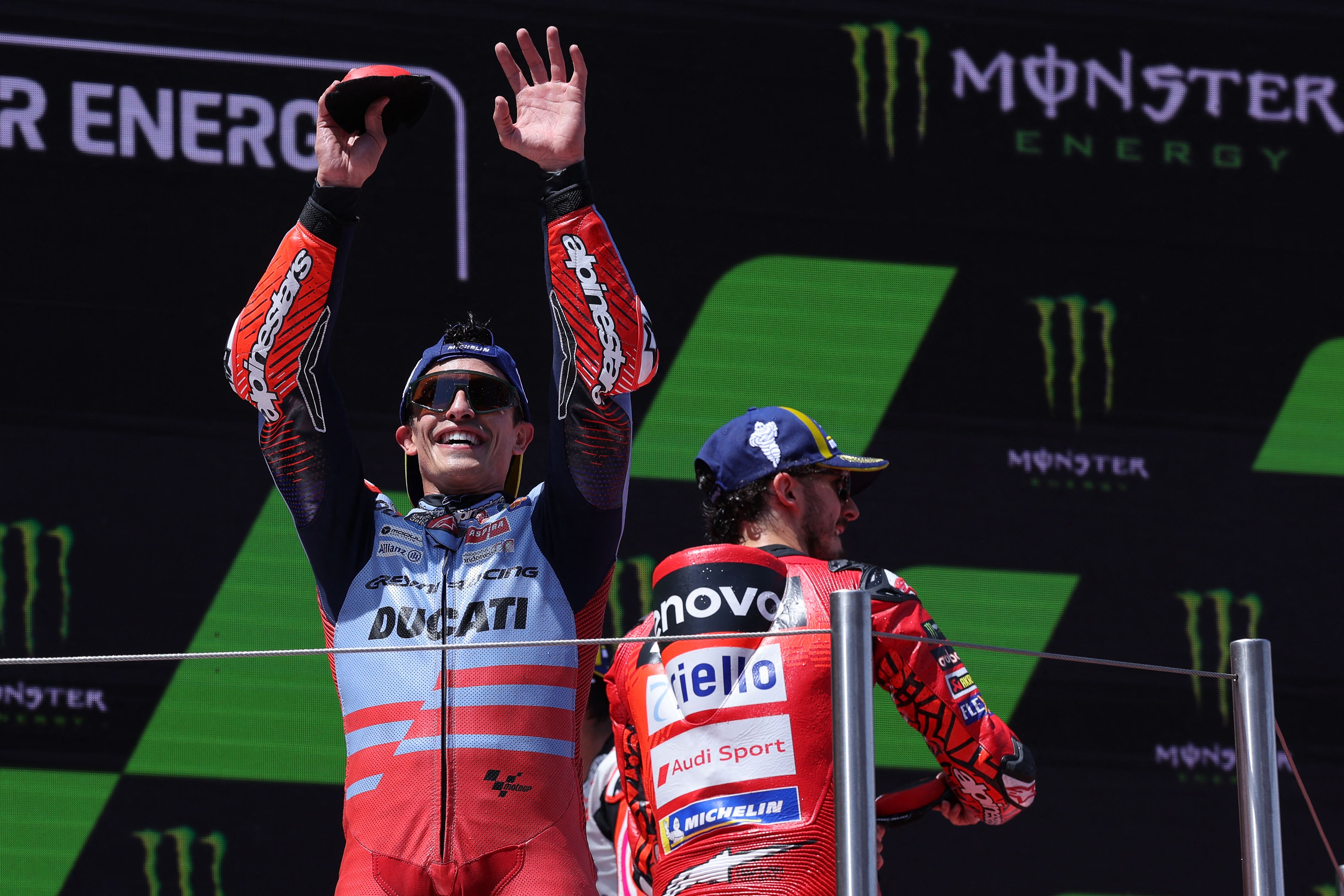 Ducati Spanish rider Marc Marquez (L) and Ducati Italian rider Francesco Bagnaia celebrate on the podium after the MotoGP Race of the Moto Grand Prix of Catalonia at the Circuit de Catalunya on May 26, 2024 in Montmelo on the outskirts of Barcelona. (Photo by LLUIS GENE / AFP)