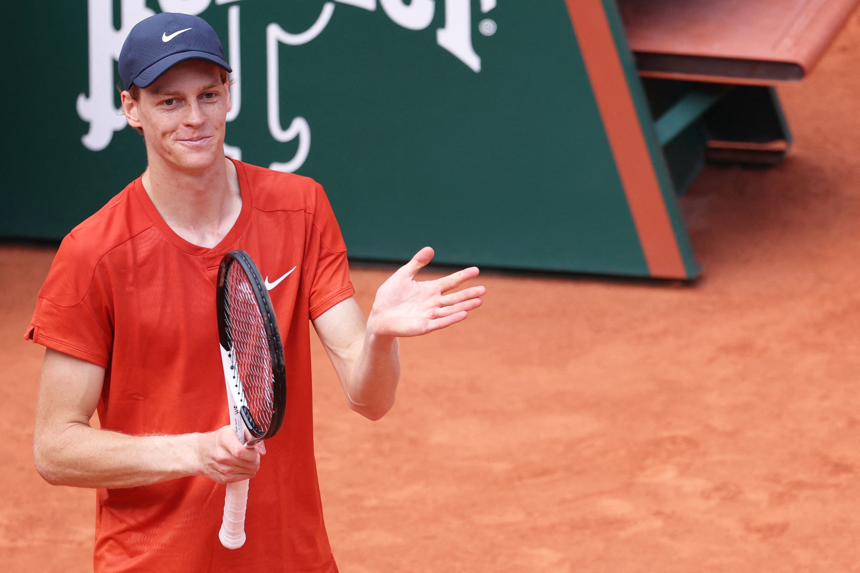 Italy's Jannik Sinner celebrates after winning against Bulgaria's Grigor Dimitrov at the end of their men's singles quarter final match on Court Philippe-Chatrier on day ten of the French Open tennis tournament at the Roland Garros Complex in Paris on June 4, 2024. (Photo by ALAIN JOCARD / AFP)
