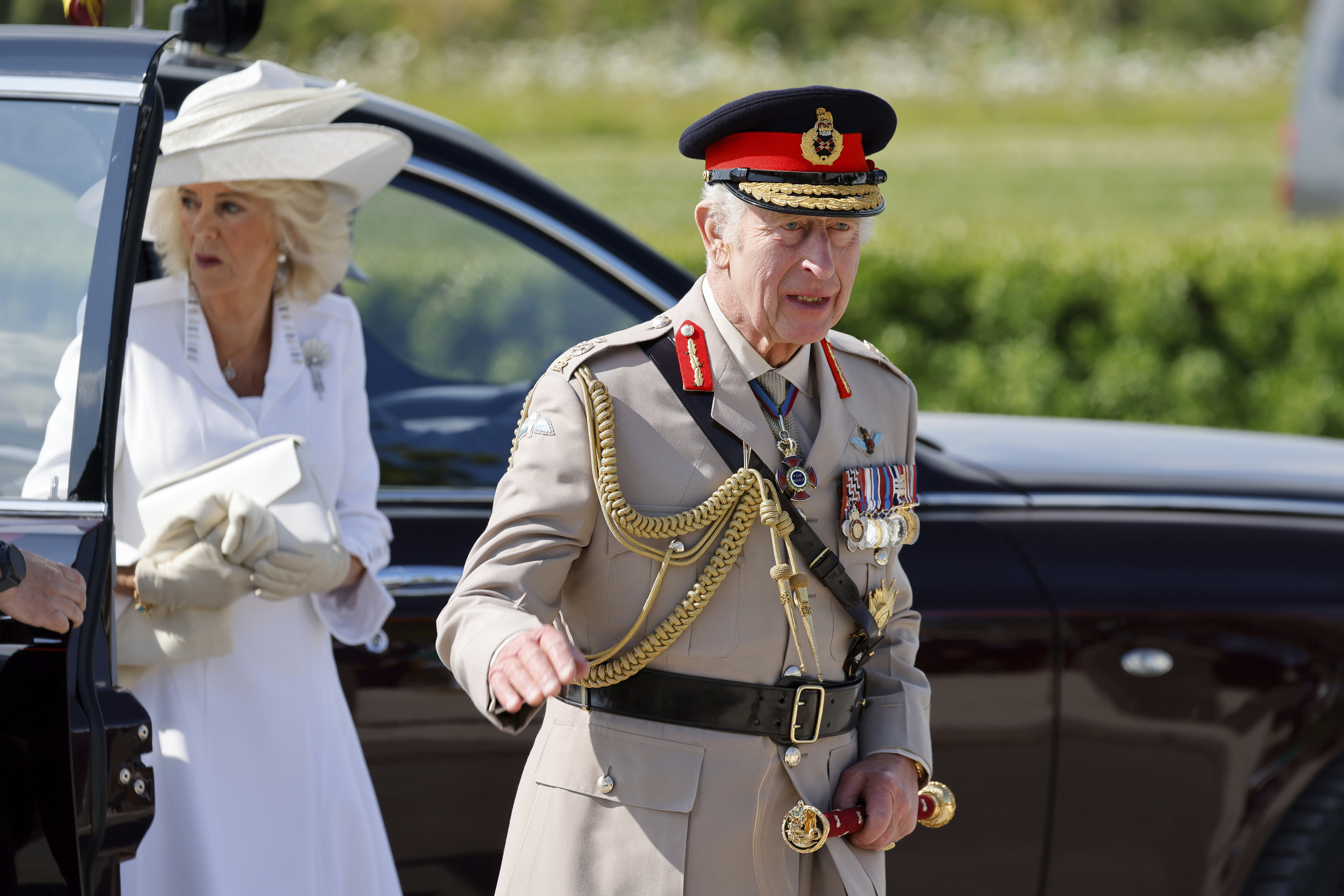 Britain's King Charles III and Britain's Queen Camilla arrive to a commemorative ceremony marking the 80th anniversary of the World War II D-Day" Allied landings in Normandy, at the World War II British Normandy Memorial of Ver-sur-Mer, Thursday, June 6, 2024. Normandy is hosting various events to officially commemorate the 80th anniversary of the D-Day landings that took place on June 6, 1944. (Ludovic Marin/Pool via AP)