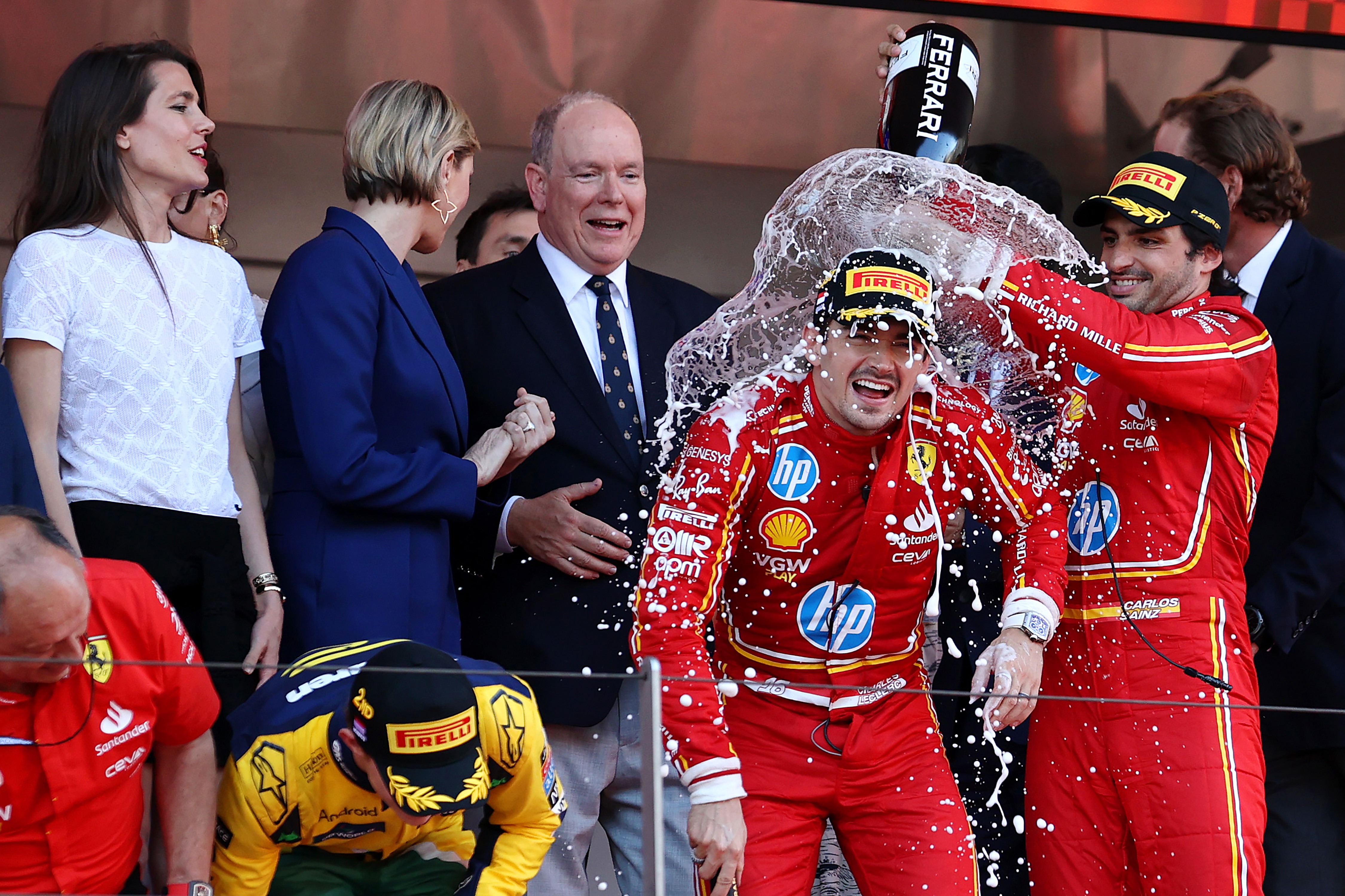 MONTE-CARLO, MONACO - MAY 26: Race winner Charles Leclerc of Monaco and Ferrari and Third placed Carlos Sainz of Spain and Ferrari celebrate on the podium during the F1 Grand Prix of Monaco at Circuit de Monaco on May 26, 2024 in Monte-Carlo, Monaco. (Photo by Ryan Pierse/Getty Images) *** BESTPIX ***
