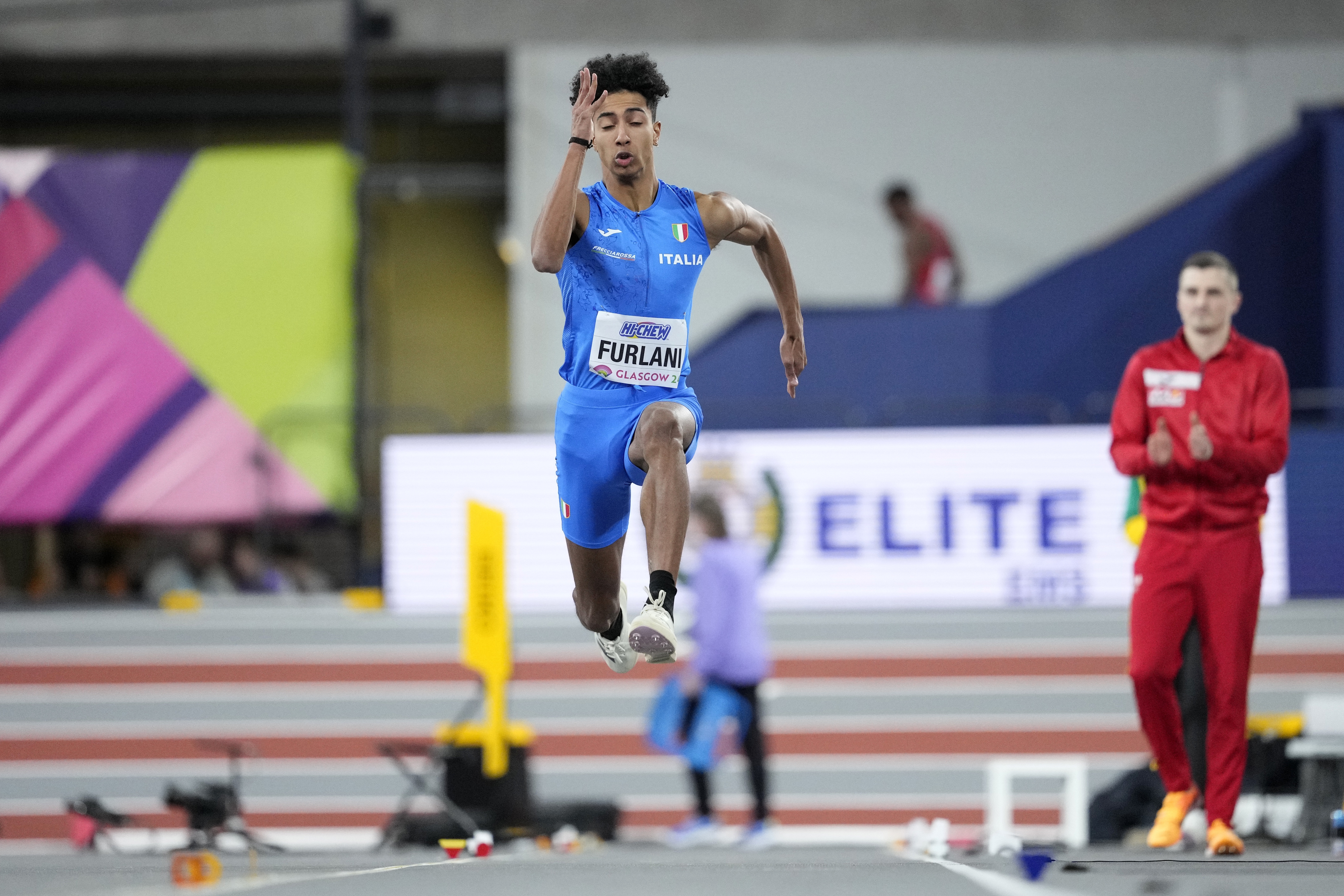 Mattia Furlani, of Italy, makes an attempt in the men's long jump during the World Athletics Indoor Championships at the Emirates Arena in Glasgow, Scotland, Saturday, March 2, 2024. (AP Photo/Bernat Armangue)