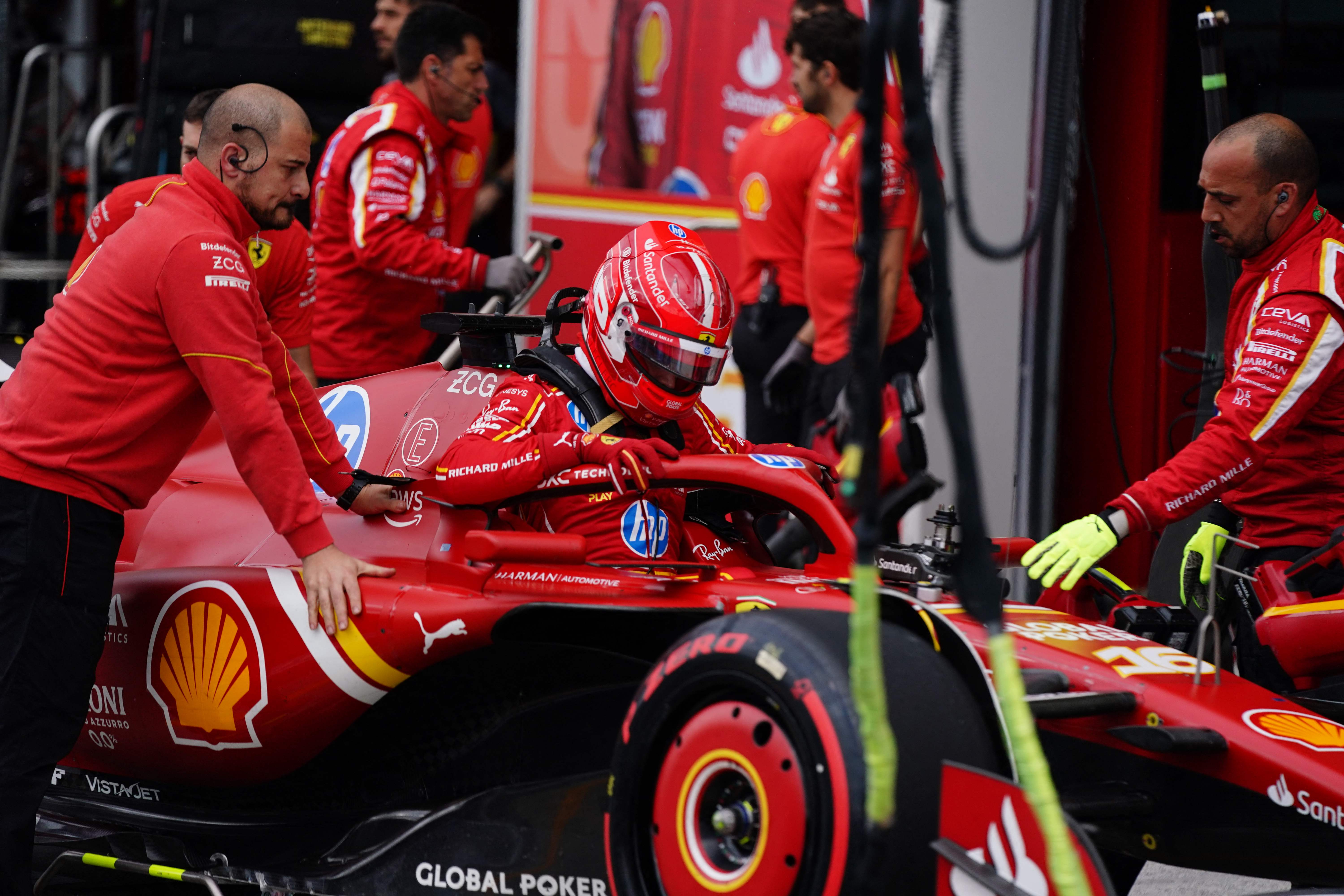 Ferrari's Monegasque driver Charles Leclerc returns to his garage during the qualifying session for the 2024 Canada Formula One Grand Prix at Circuit Gilles-Villeneuve in Montreal, Canada, on June 8, 2024. (Photo by Shawn Thew / POOL / AFP)