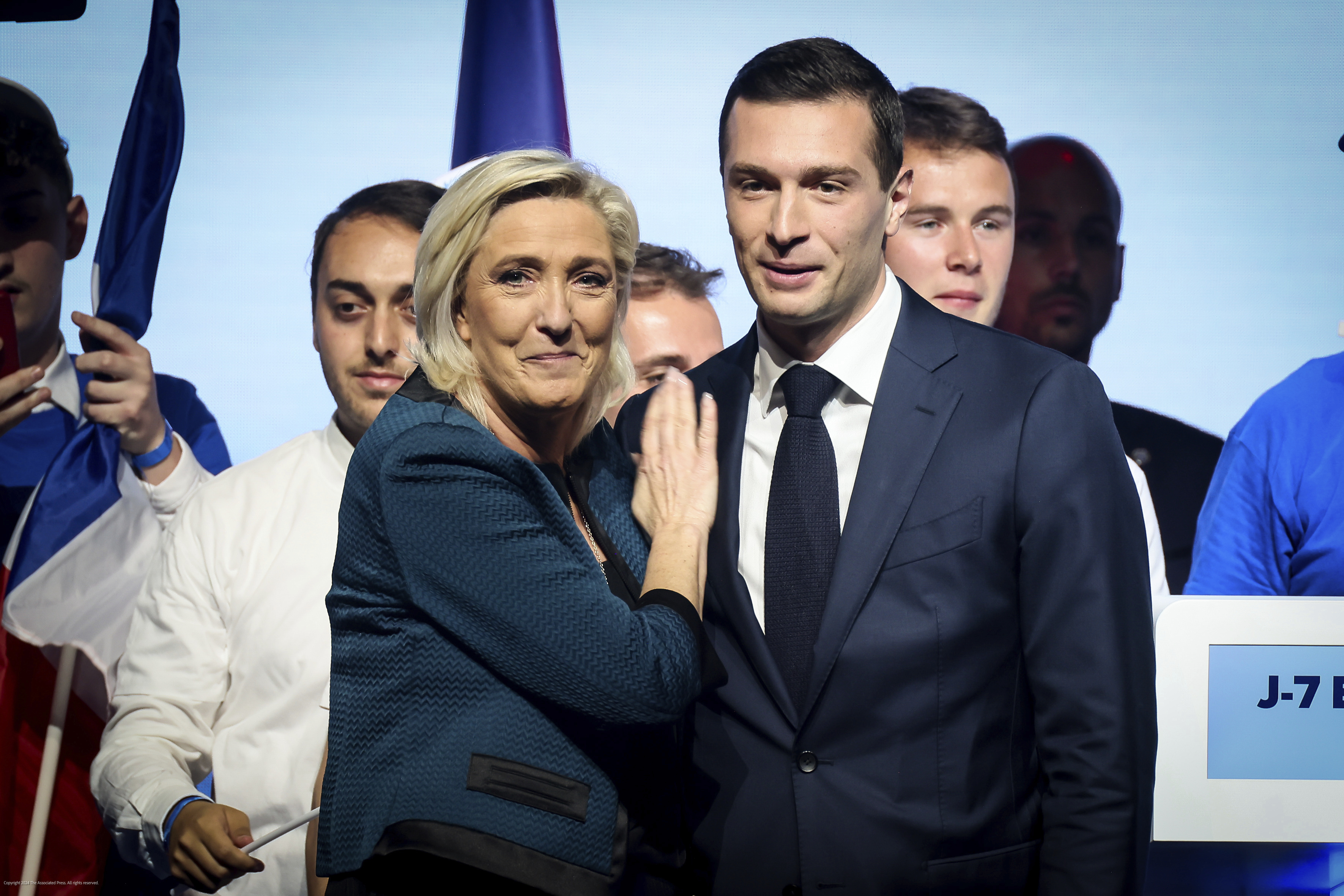 FILE -  Leader of the French far-right National Rally Marine Le Pen, left and lead candidate of the party for the upcoming European election Jordan Bardella during a political meeting on June 2, 2024 in Paris. It seemed like a throwaway line by European Commission President Ursula von der Leyen, yet it encapsulated what is at stake for many in this week's European Union parliamentary elections ? What to do with the hard right? And should it be trusted? (AP Photo/Thomas Padilla)
