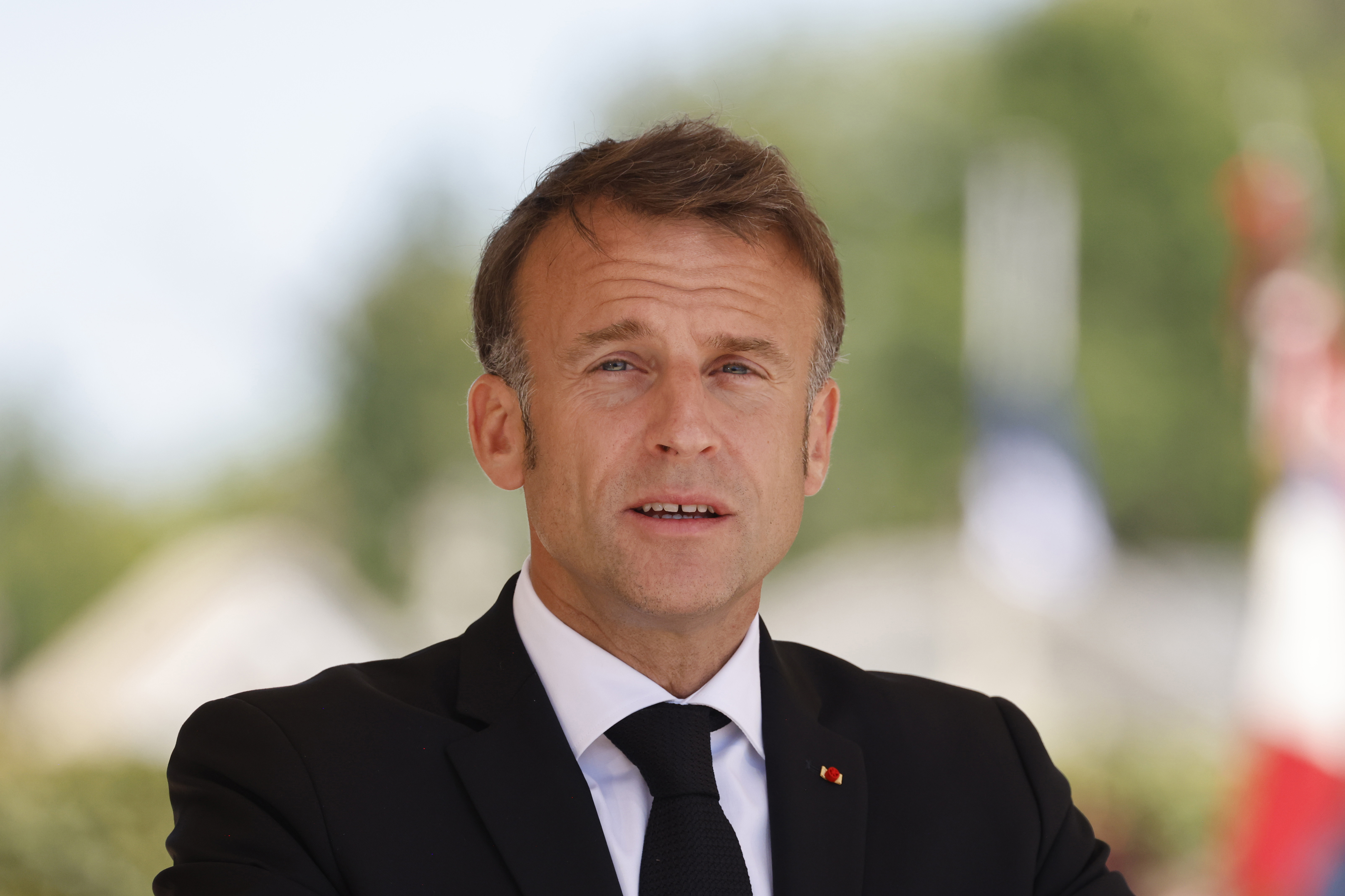 French President Emmanuel Macron speaks during a WWII in Oradour-sur-Glane, southwestern France, Monday, June 10, 2024. French President Emmanuel Macron called snap legislative elections, saying he could not ignore the new political reality after his pro-European party was handed a chastening defeat and projected to garner less than half the support of Marine Le Pen's National Rally. (Ludovic Marin via AP)