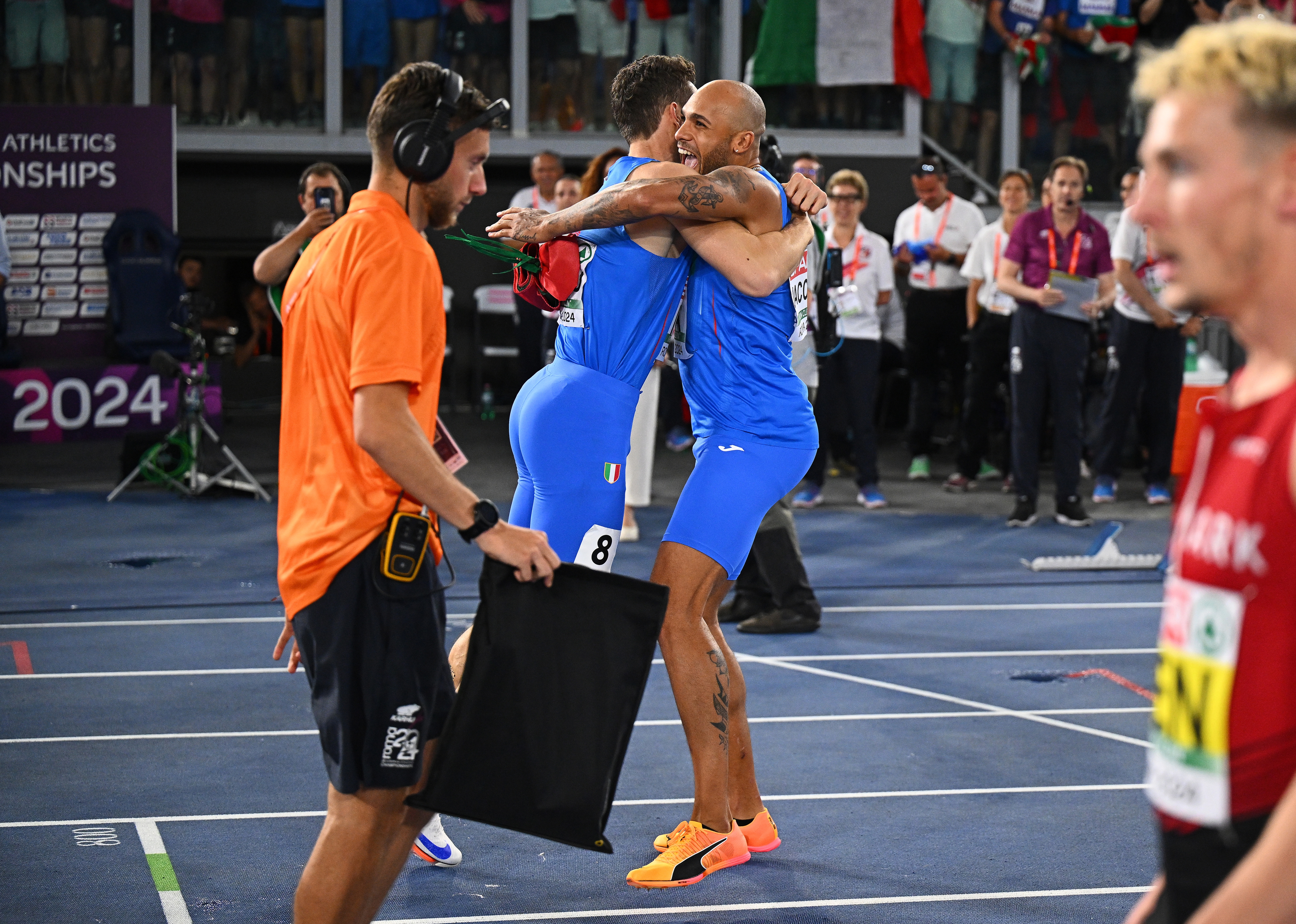 ROME, ITALY - JUNE 12:  Gold medalist Filippo Tortu of Team Italy celebrates with teammate Lamont Marcell Jacobs following the Men?s 4x100m Relay Final on day six of the 26th European Athletics Championships - Rome 2024 at Stadio Olimpico on June 12, 2024 in Rome, Italy.  (Photo by Mattia Ozbot/Getty Images for European Athletics)