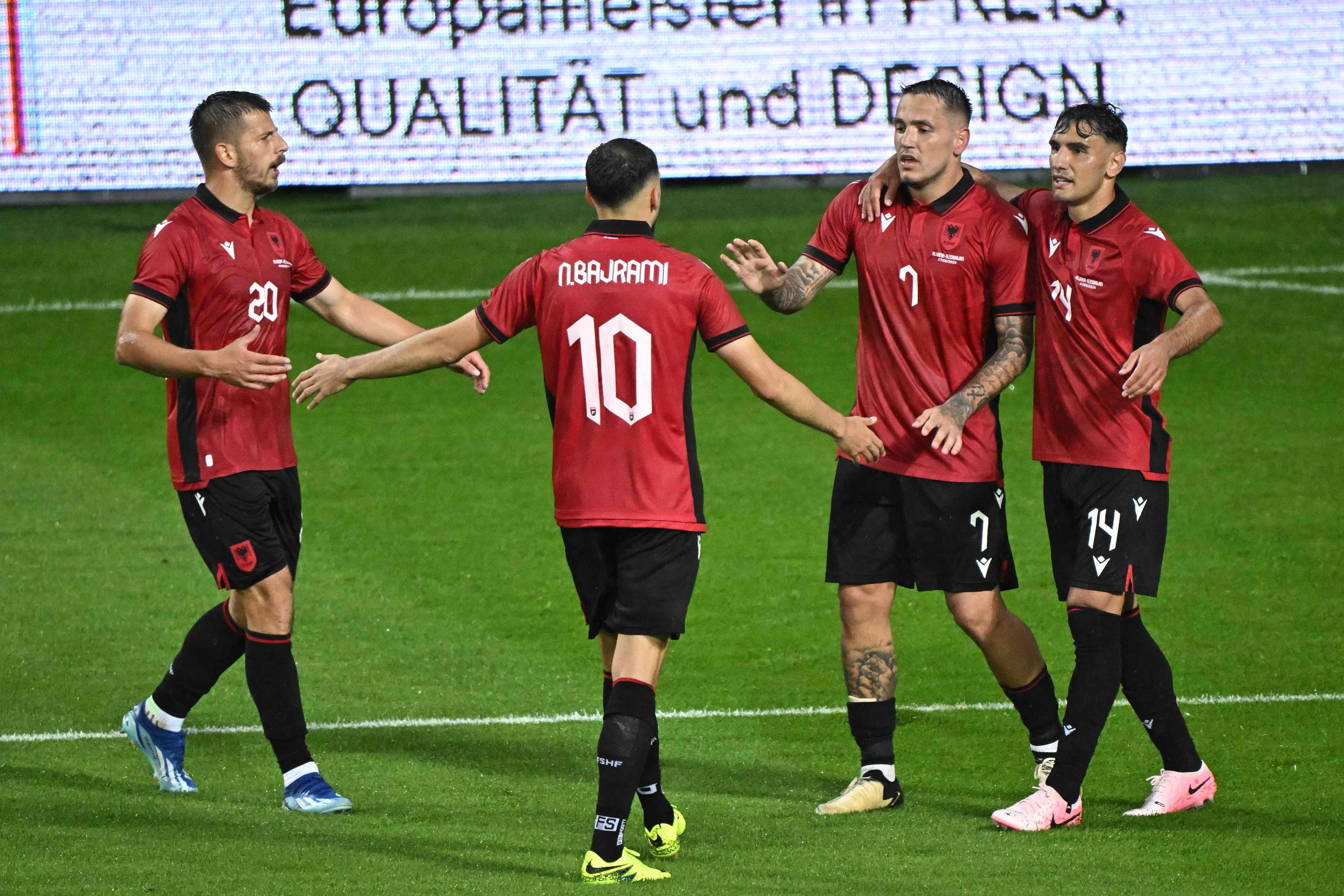 Albania's forward #7 Rey Manaj (2ndR) celebrates with team mates after scoring the 2-0 goal during the International friendly football match between Albania and Azerbaijan in Szombathely, western Hungary, on June 7, 2024. (Photo by Attila KISBENEDEK / AFP)