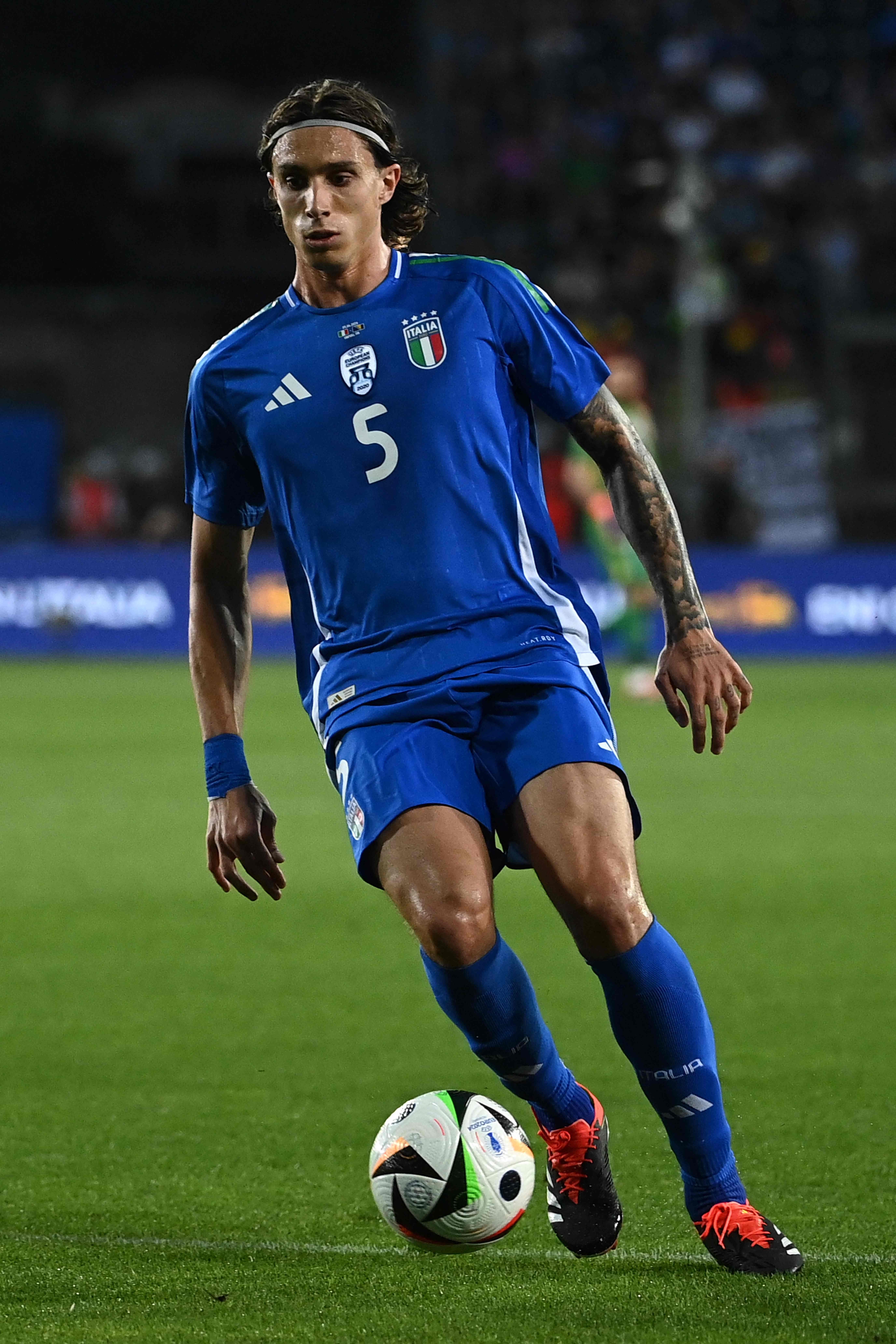 Italy's defender #05 Riccardo Calafiori controls the ball during the International friendly football match between Italy and Bosnia-Herzegovina in Empoli on June 09, 2024. (Photo by Isabella BONOTTO / AFP)