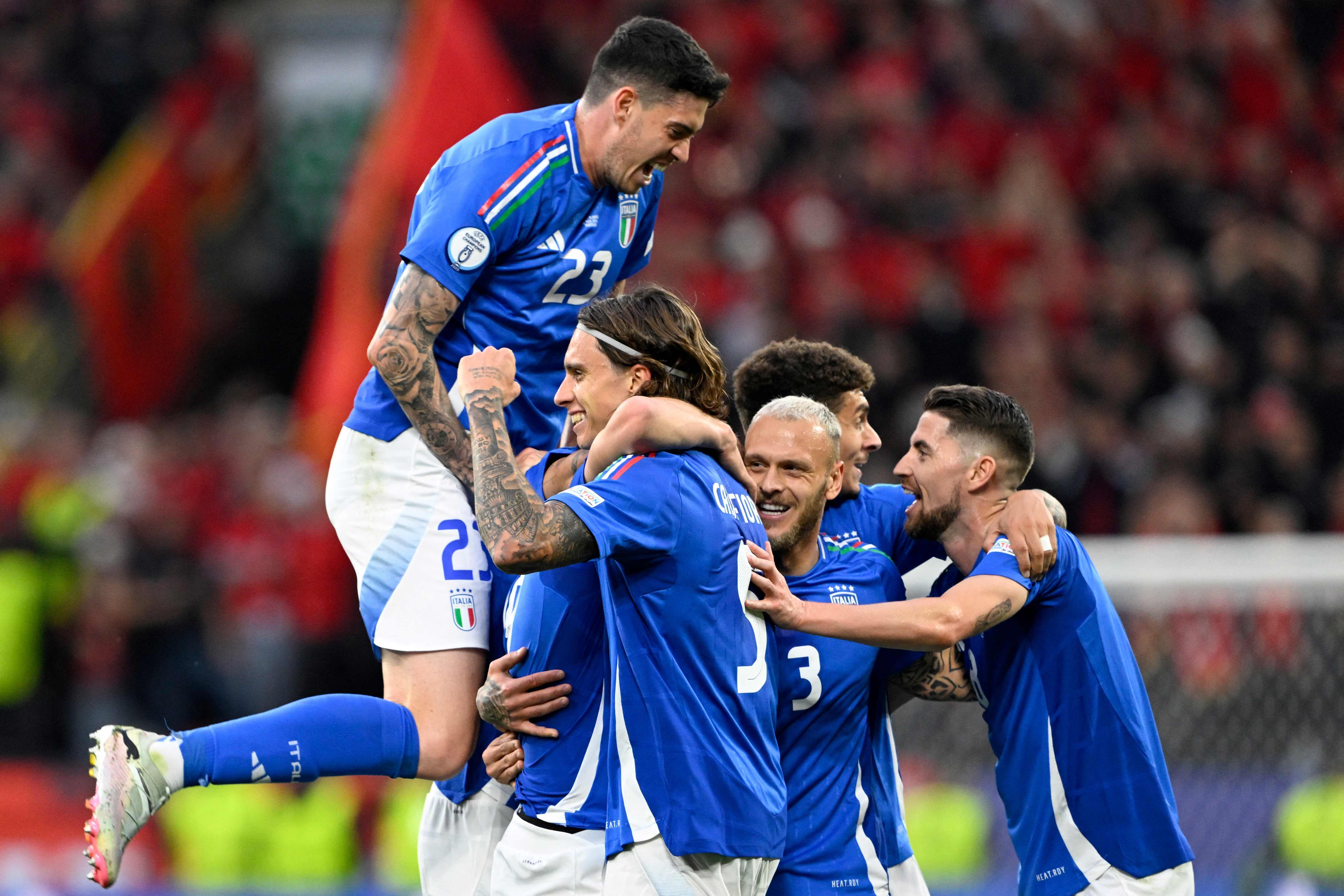 TOPSHOT - Italy's midfielder #18 Nicolo Barella celebrates with teammates scoring his team's second goal during the UEFA Euro 2024 Group B football match between Italy and Albania at the BVB Stadion in Dortmund on June 15, 2024. (Photo by INA FASSBENDER / AFP)