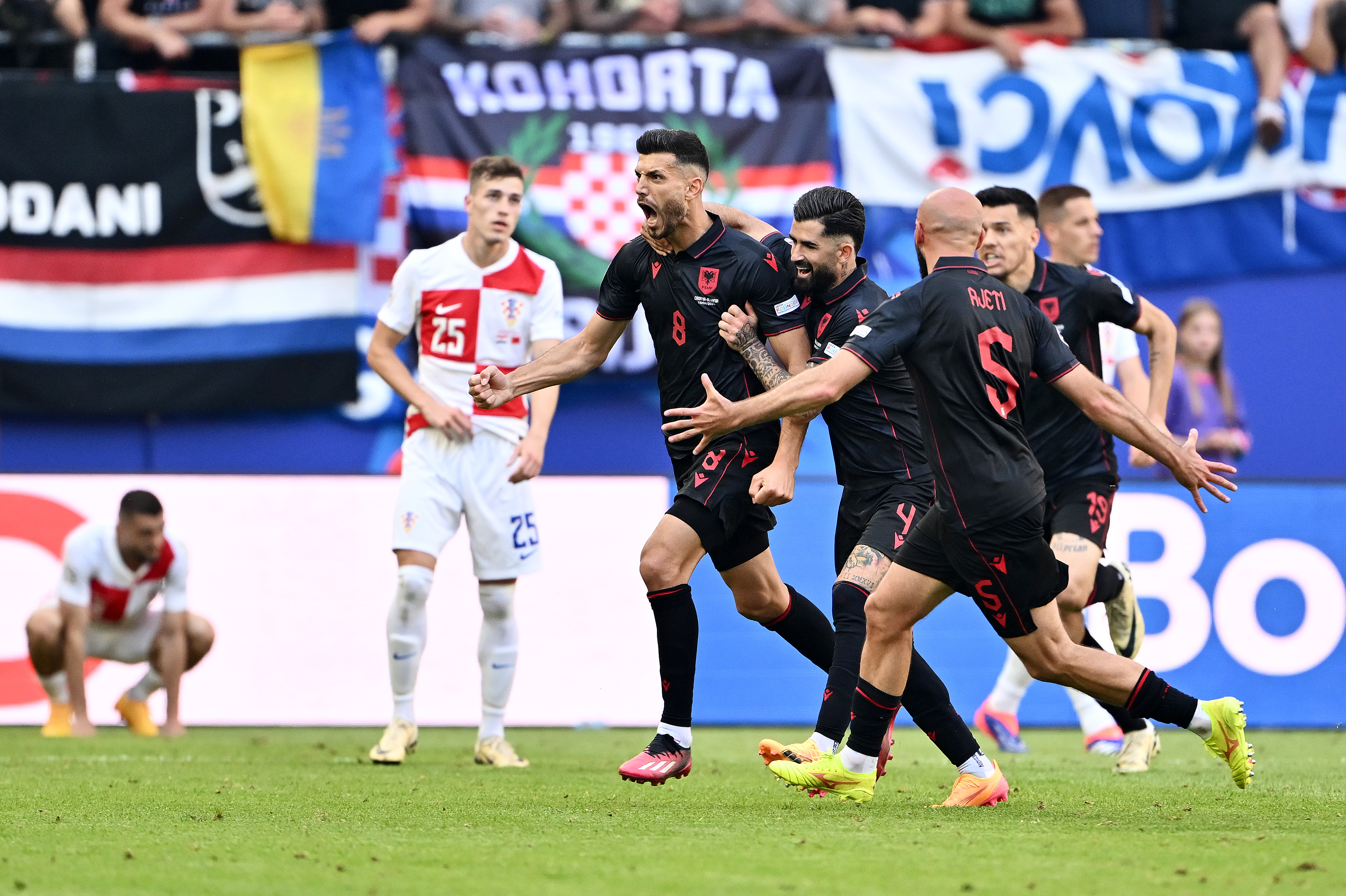 HAMBURG, GERMANY - JUNE 19: Klaus Gjasula of Albania celebrates scoring his team's second goal with teammates during the UEFA EURO 2024 group stage match between Croatia and Albania at Volksparkstadion on June 19, 2024 in Hamburg, Germany. (Photo by Dan Mullan/Getty Images)