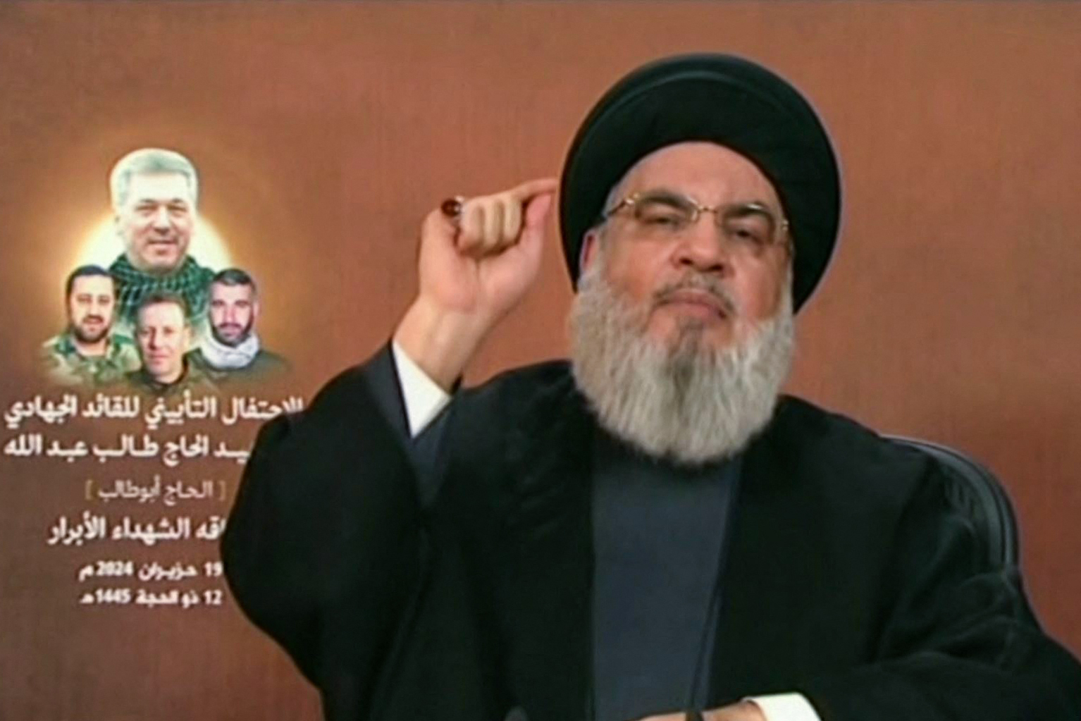 An image grab taken from Hezbollah's al-Manar TV on June 19, 2024, shows Hezbollah chief Hassan Nasrallah giving a televised address from an undisclosed location in Lebanon. Nasrallah on June 19 warned "no place" in Israel would be spared from the group's weapons in case of a full-blown war, after Israel said operational plans for a Lebanon offensive had been approved. (Photo by Al-Manar / AFP) / RESTRICTED TO EDITORIAL USE - MANDATORY CREDIT "AFP PHOTO / HO / AL-MANAR" - NO MARKETING NO ADVERTISING CAMPAIGNS - DISTRIBUTED AS A SERVICE TO CLIENTS