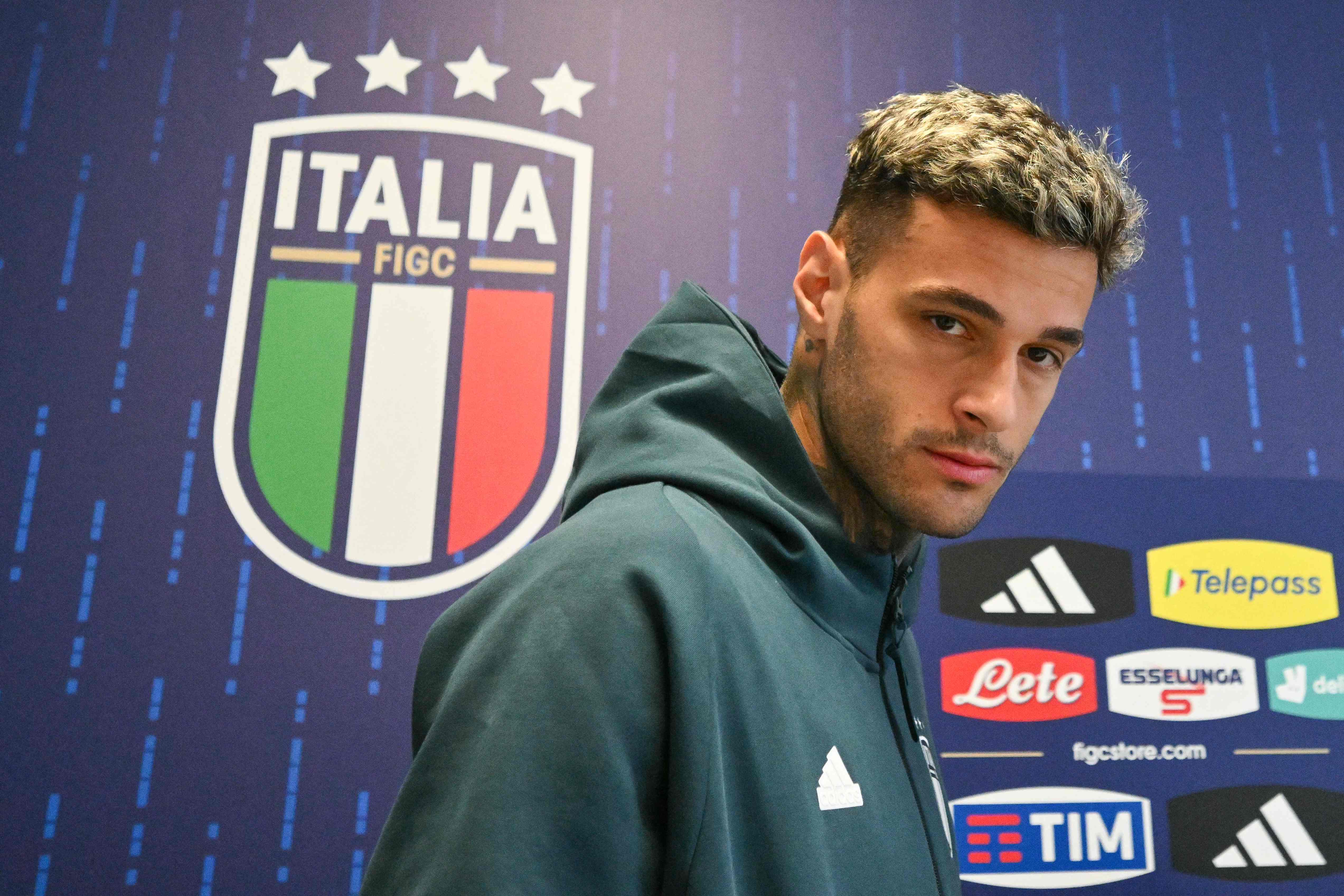 Italys forward #9 Gianluca Scamacca arrives to attend a press conference at the team's base camp in Iserlohn, on June 13, 2024, ahead of the UEFA Euro 2024 football Championship. (Photo by Alberto PIZZOLI / AFP)