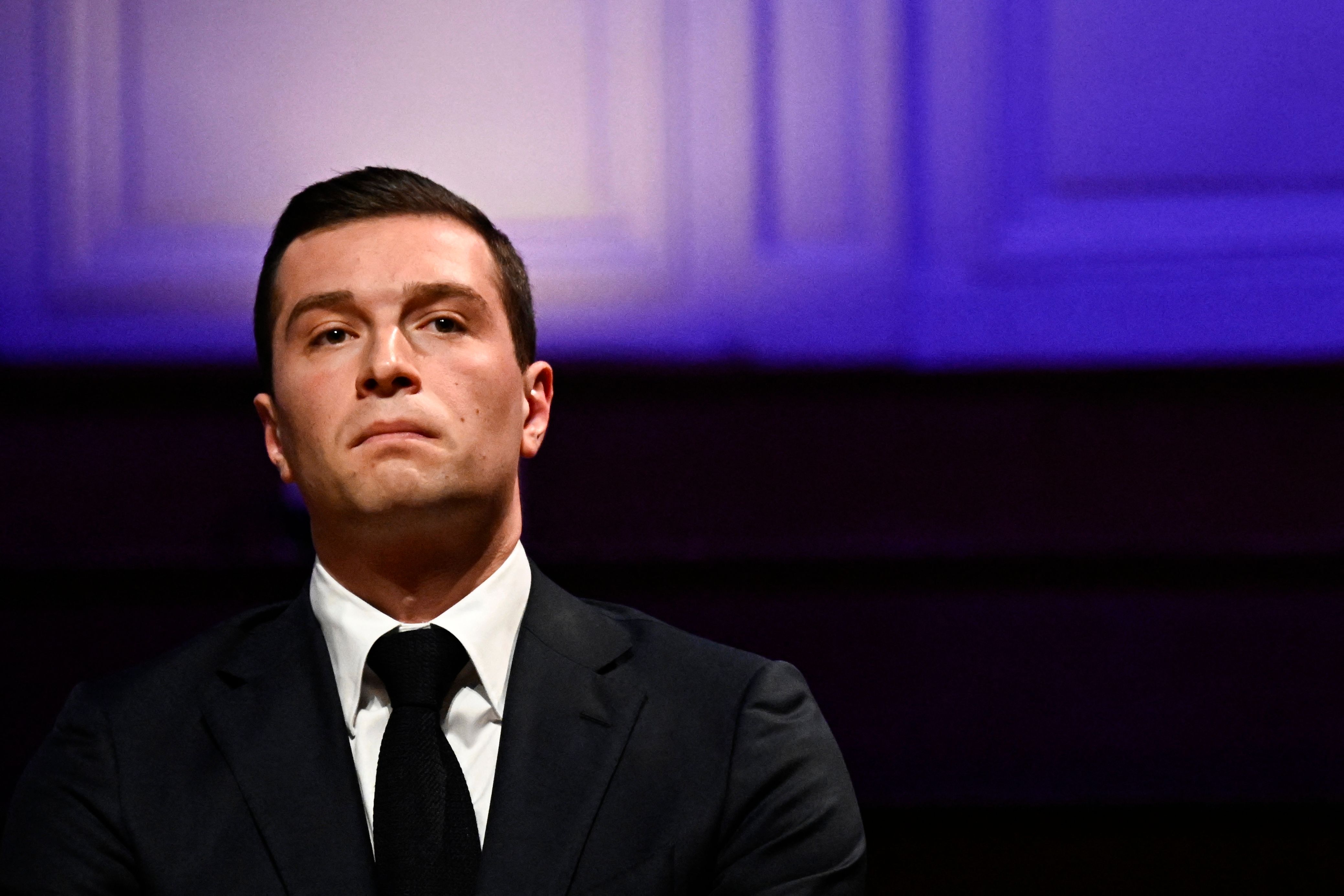 French far-right Rassemblement National (RN) party President and lead MEP Jordan Bardella  looks on during a meeting with French employers' association Movement of the Enterprises of France (MEDEF) gathering party and coalition leaders ahead of legislative elections, in Paris on June 20, 2024. (Photo by JULIEN DE ROSA / AFP)