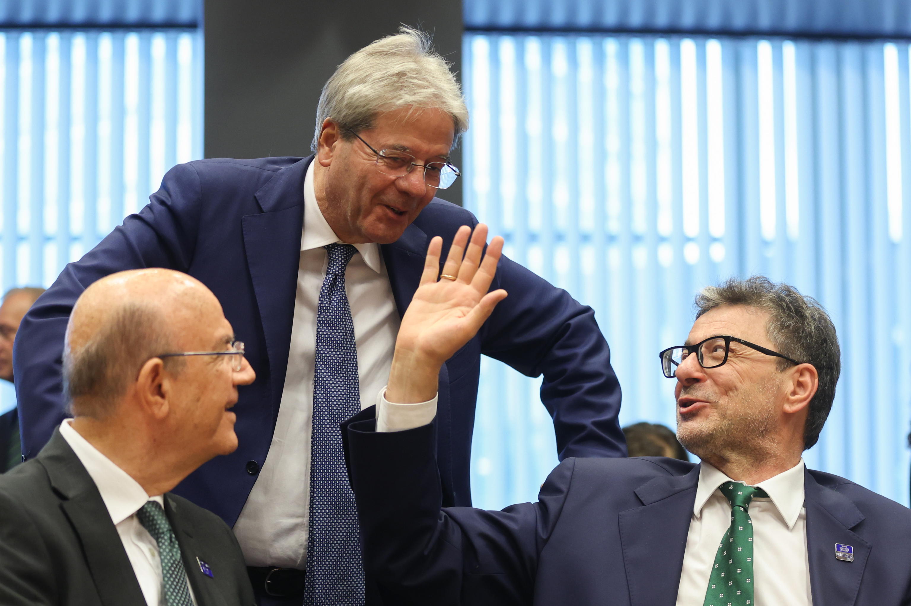 epa11425385 (L-R) Minister of Finance of Cyprus Makis Keravnos, European Commissioner in charge of Economy Paolo Gentiloni and Italian Minister of Economy and Finance Giancarlo Giorgetti at the start of a Eurogroup finance ministers meeting in Luxembourg City, Luxembourg, 20 June 2024.  EPA/OLIVIER HOSLET