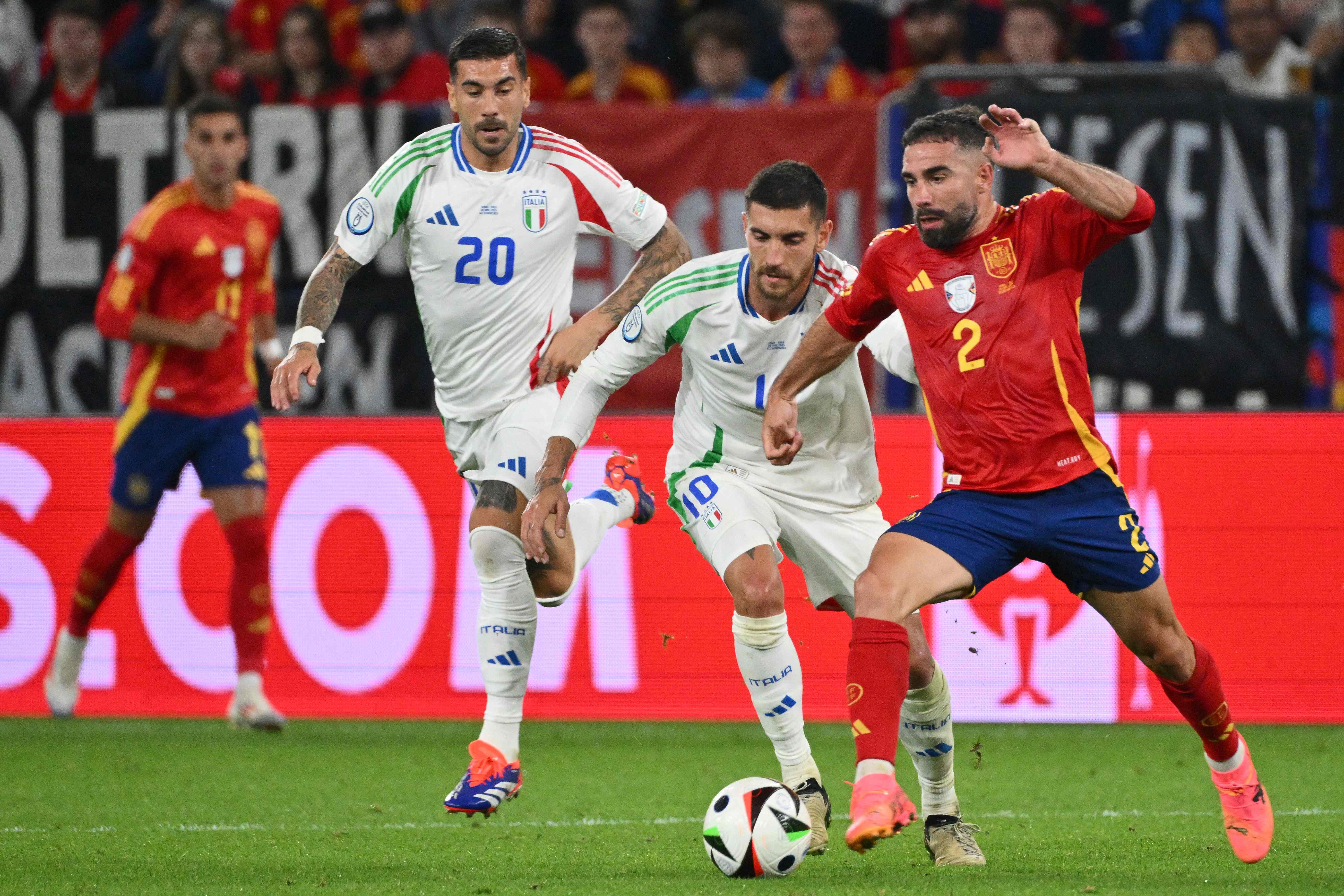 Spain's defender #02 Dani Carvajal (R) fights for the ball with Italy's midfielder #10 Lorenzo Pellegrini (2R) during the UEFA Euro 2024 Group B football match between Spain and Italy at the Arena AufSchalke in Gelsenkirchen on June 20, 2024. (Photo by Alberto PIZZOLI / AFP)