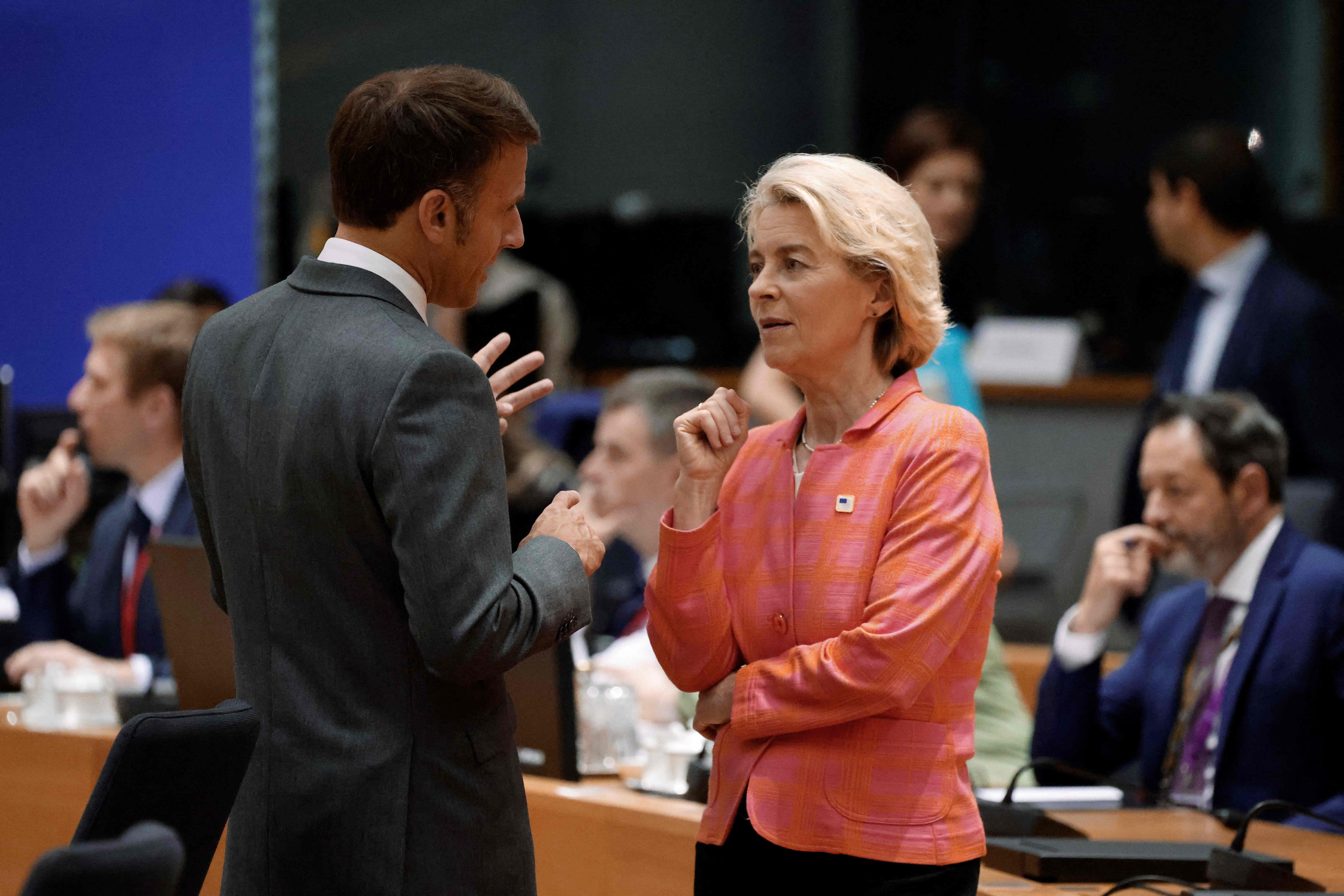 France's President Emmanuel Macron (L) talks with President of the European Commission Ursula von der Leyen ahead of the European Council Summit at the EU headquarters in Brussels on June 27, 2024. (Photo by Ludovic MARIN / AFP)