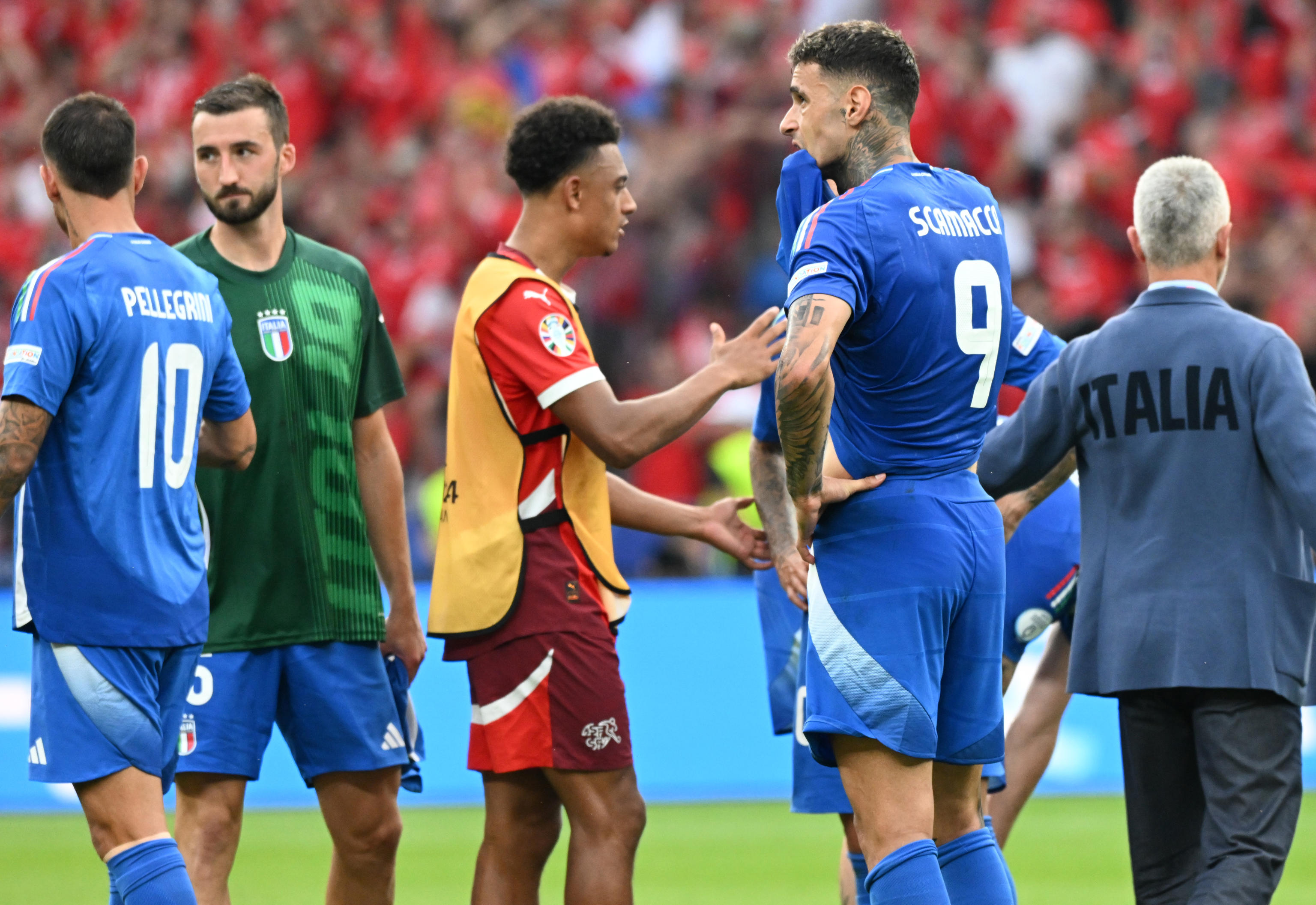 Italys forward Gianluca Scamacca (C) shows his dejection at the end of the round of sixteen UEFA EURO 2024 soccer match between Italy and Switzeland at Olympiastadion in Berlin, Germany, 29 June 2024. ANSA/DANIEL DAL ZENNARO