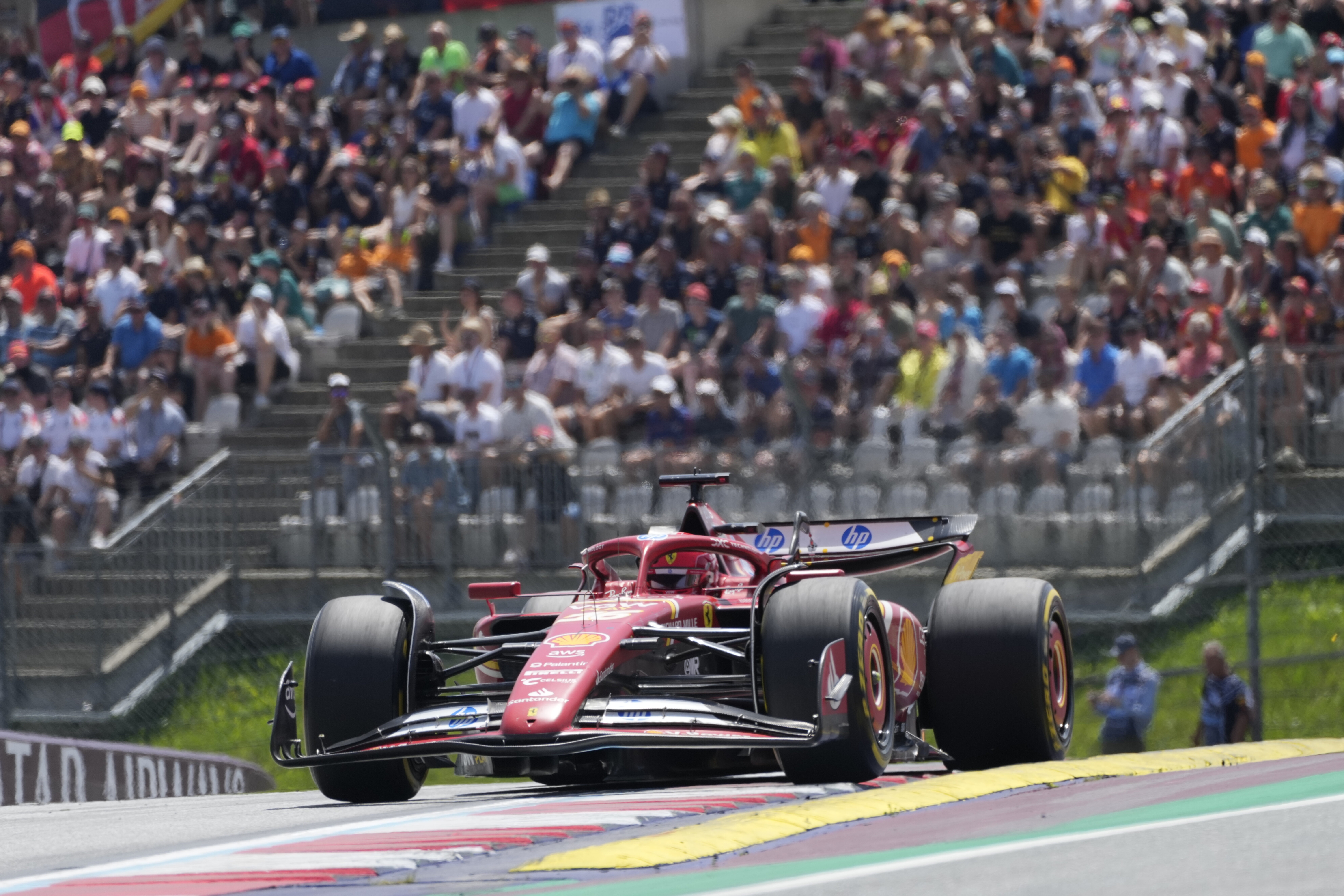 Ferrari driver Charles Leclerc of Monaco steers his car during the sprint race at the Red Bull Ring racetrack in Spielberg, Austria, Saturday, June 29, 2024. The Austrian Formula One Grand Prix will be held on Sunday. (AP Photo/Darko Bandic)