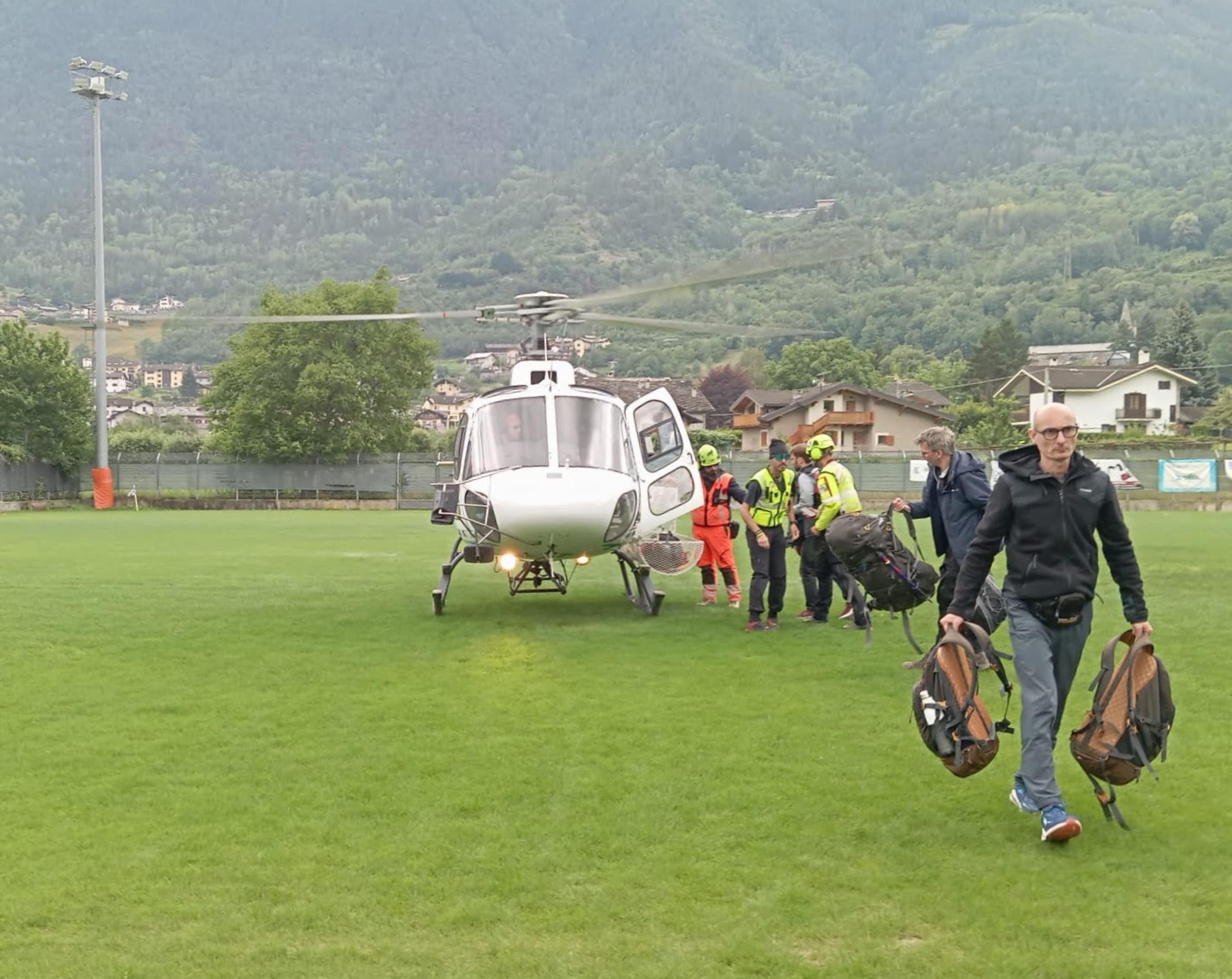 One of the helicopters involved in operations to evacuate citizens left isolated in Cogne while stopping at the Corrado Gex airport in Saint-Christophe (Aosta), Italy, 30 June 2024. ANSA/Cristina Porta