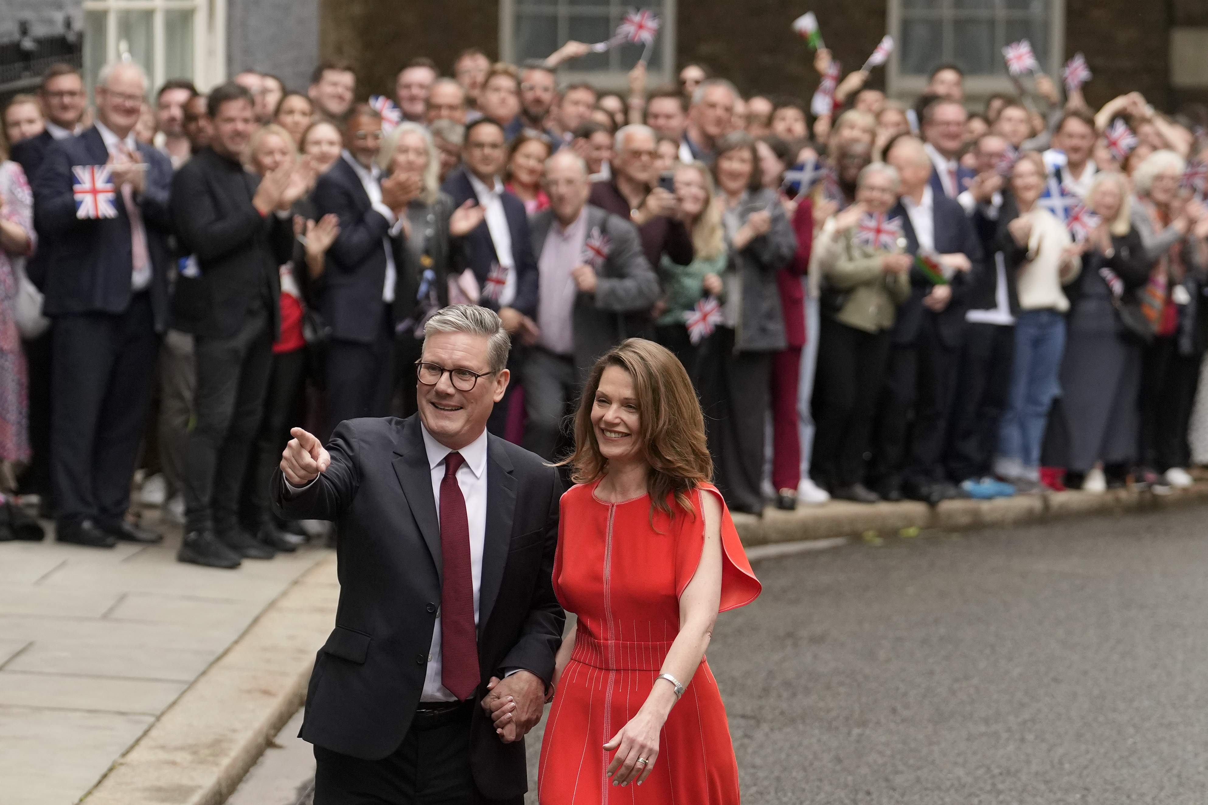 Britain's Labour Party Prime Minister Keir Starmer and his wife Victoria arrive in Downing Street and greet supporters in London, Friday, July 5, 2024. Labour leader Stammer won the general election on July 4, and was appointed Prime Minster by King Charles III at Buckingham Palace, after the party won a landslide victory. (AP Photo/Vadim Ghirda)