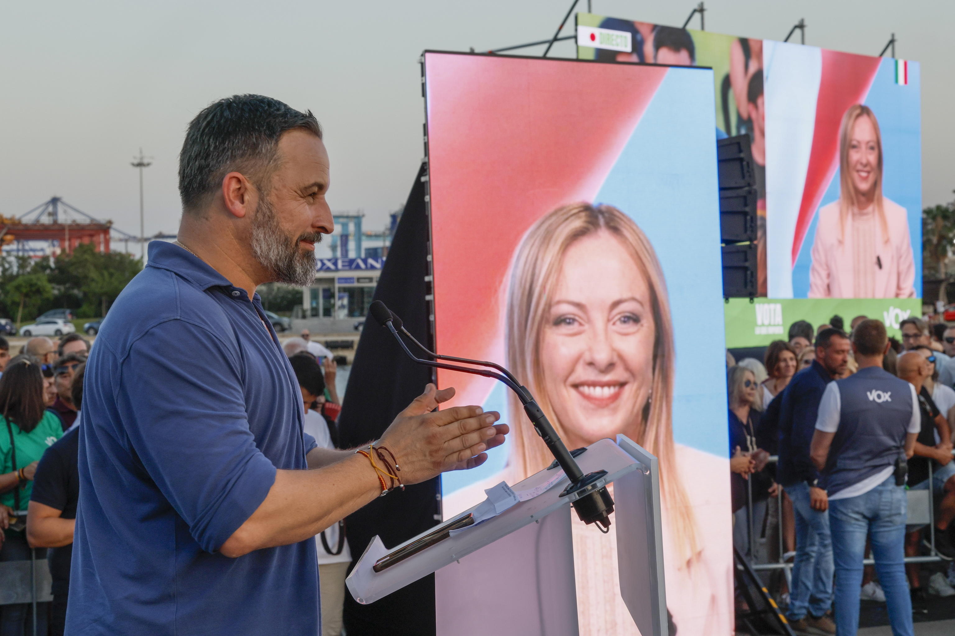epa10753822 Vox far right party leader Santiago Abascal addresses the crowd close to a screen showing Italian Primer Minister Giorgia Meloni, who took part in the event by video conference, during a rally in La Marina, Valencia, Spain, 13 July 2023 (issued 18 July 2023). Spain will hold general elections on 23 July 2023.  EPA/BIEL ALINO