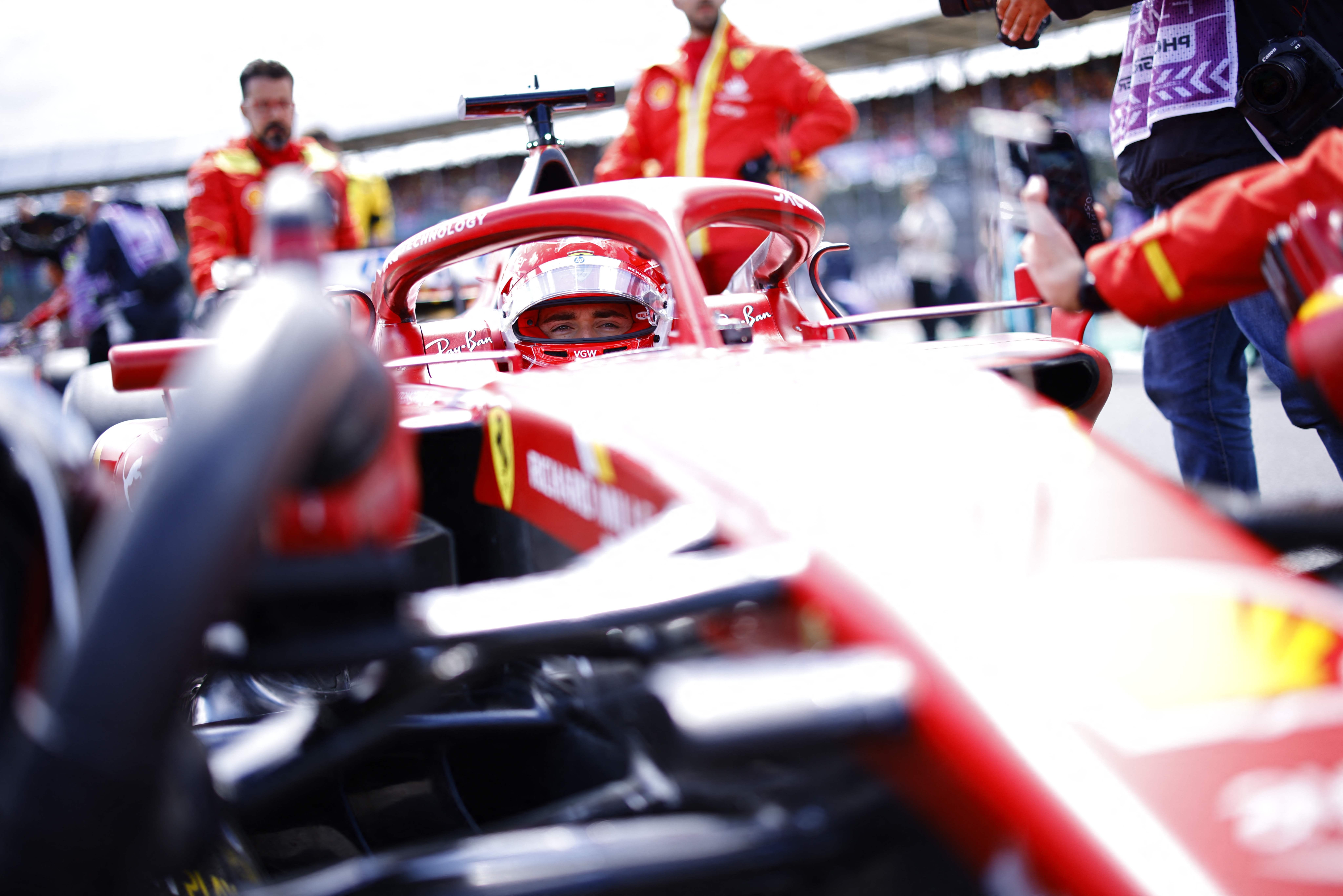 Ferrari's Monegasque driver Charles Leclerc waits to compete in the Formula One British Grand Prix at the Silverstone motor racing circuit in Silverstone, central England, on July 7, 2024. (Photo by BENJAMIN CREMEL / AFP)