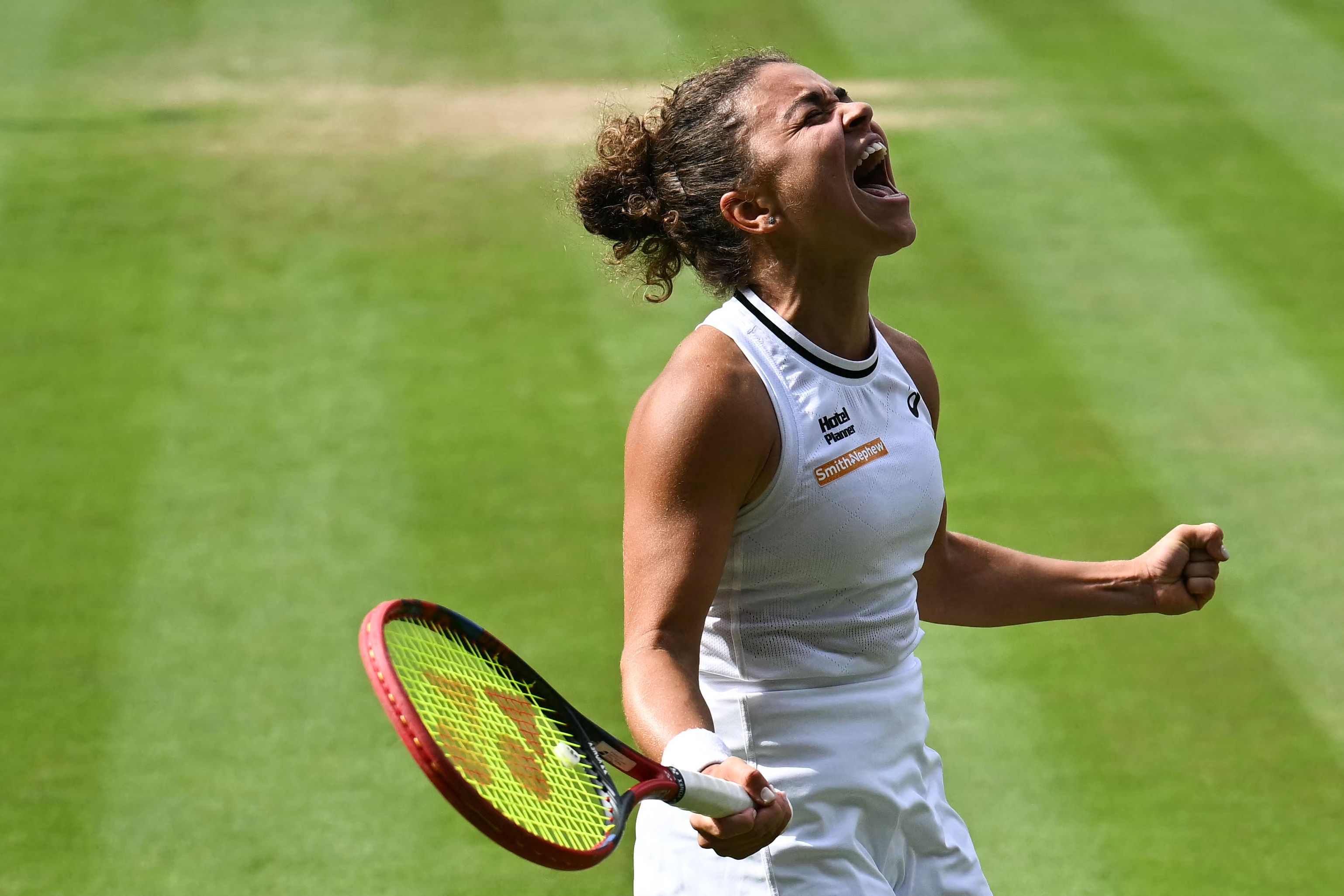 Italy's Jasmine Paolini celebrates winning against Croatia's Donna Vekic during their women's singles semi-final tennis match on the eleventh day of the 2024 Wimbledon Championships at The All England Lawn Tennis and Croquet Club in Wimbledon, southwest London, on July 11, 2024. Paolini won the match 2-6, 6-4, 7-6. (Photo by Ben Stansall / AFP) / RESTRICTED TO EDITORIAL USE