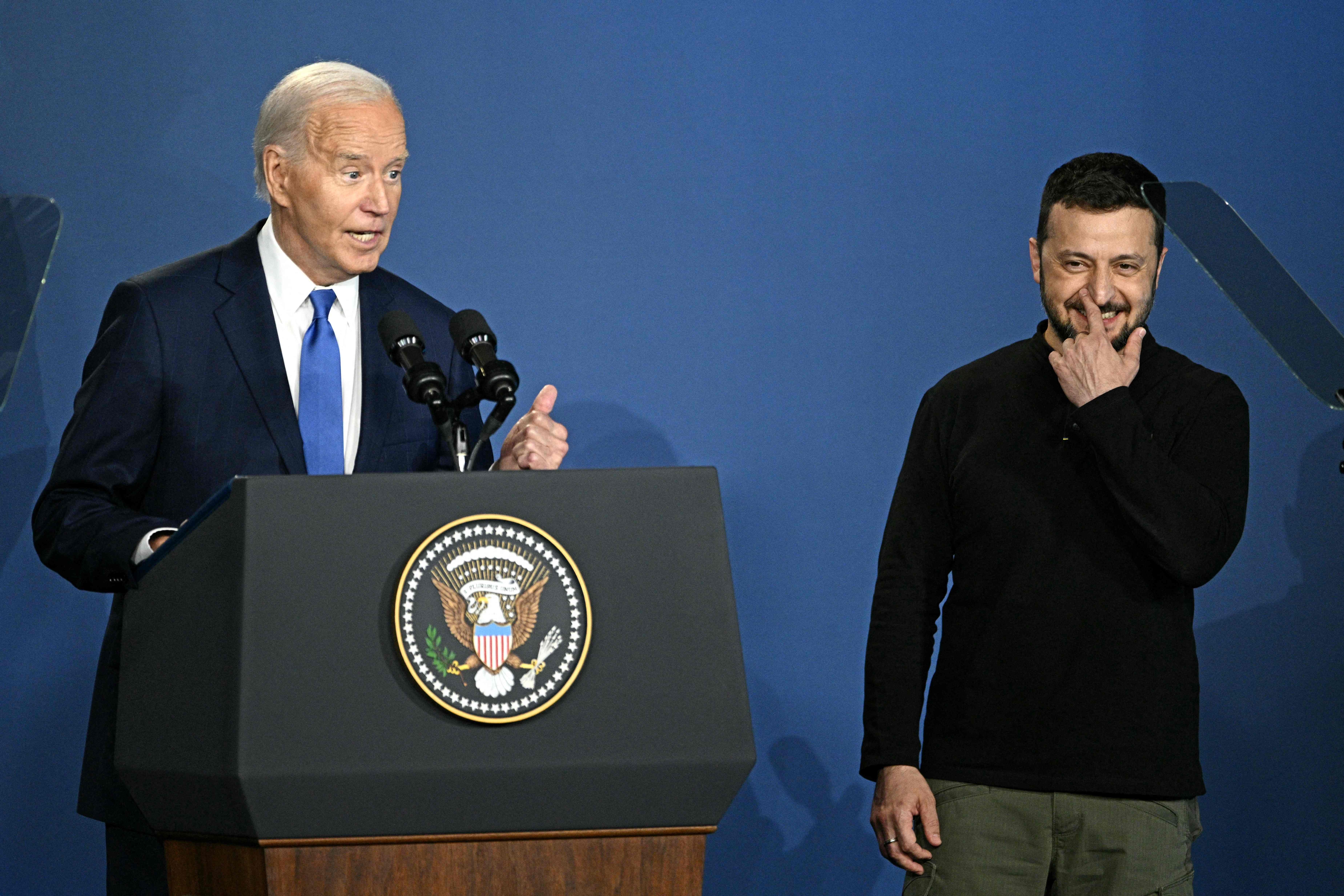 US President Joe Biden corrects himself after accidentally introducing  Ukraine's President Volodymyr Zelensky (R) as Russia's President Vladimir Putin during the Ukraine Compact initiative on the sidelines of the NATO Summit at the Walter E. Washington Convention Center in Washington, DC, on July 11, 2024. (Photo by Brendan SMIALOWSKI / AFP)