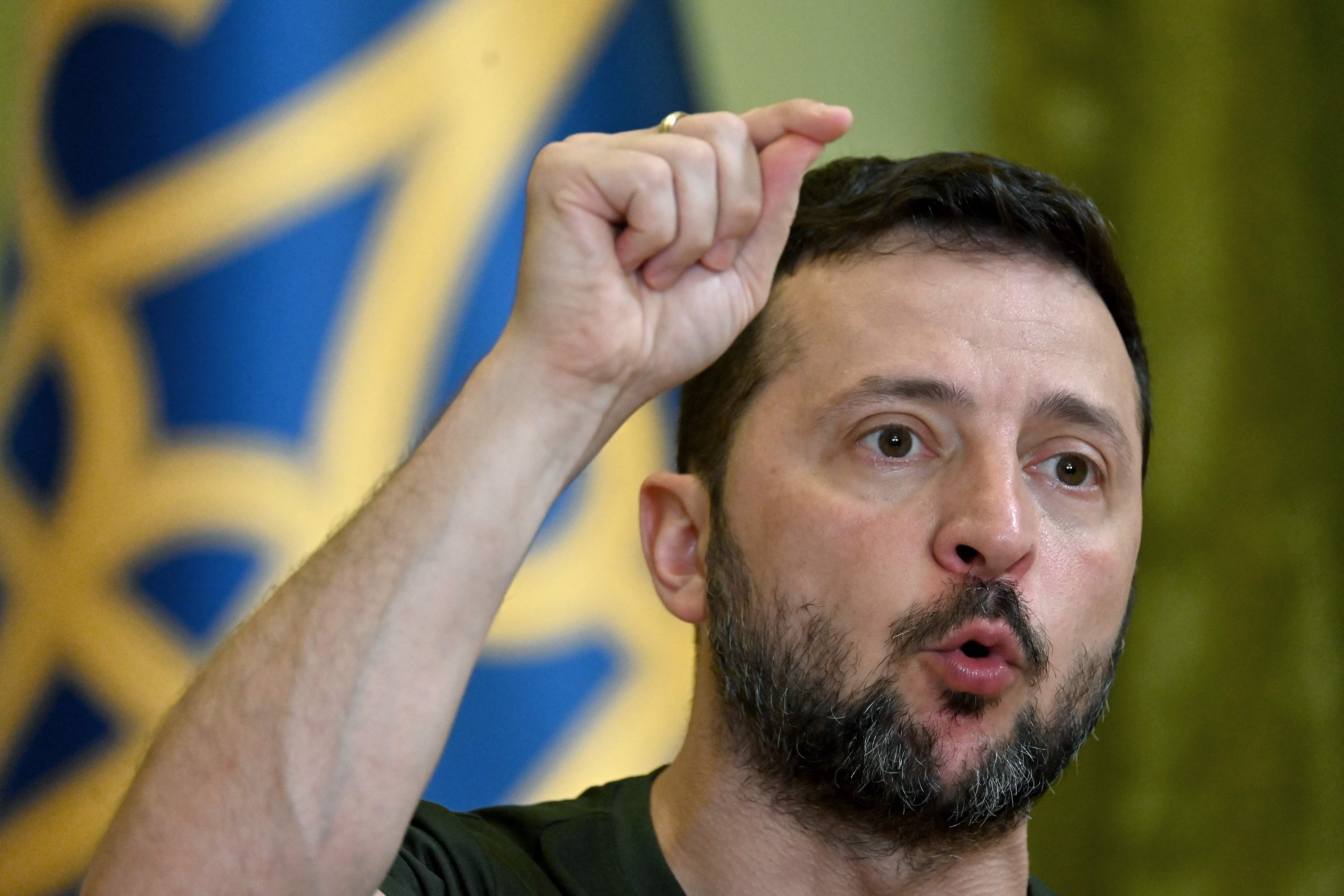 Ukraine's President Volodymyr Zelensky gestures as he speaks during his press-conference in Kyiv on July 15, 2024, amid Russian invasion in Ukraine. (Photo by Sergei SUPINSKY / AFP)