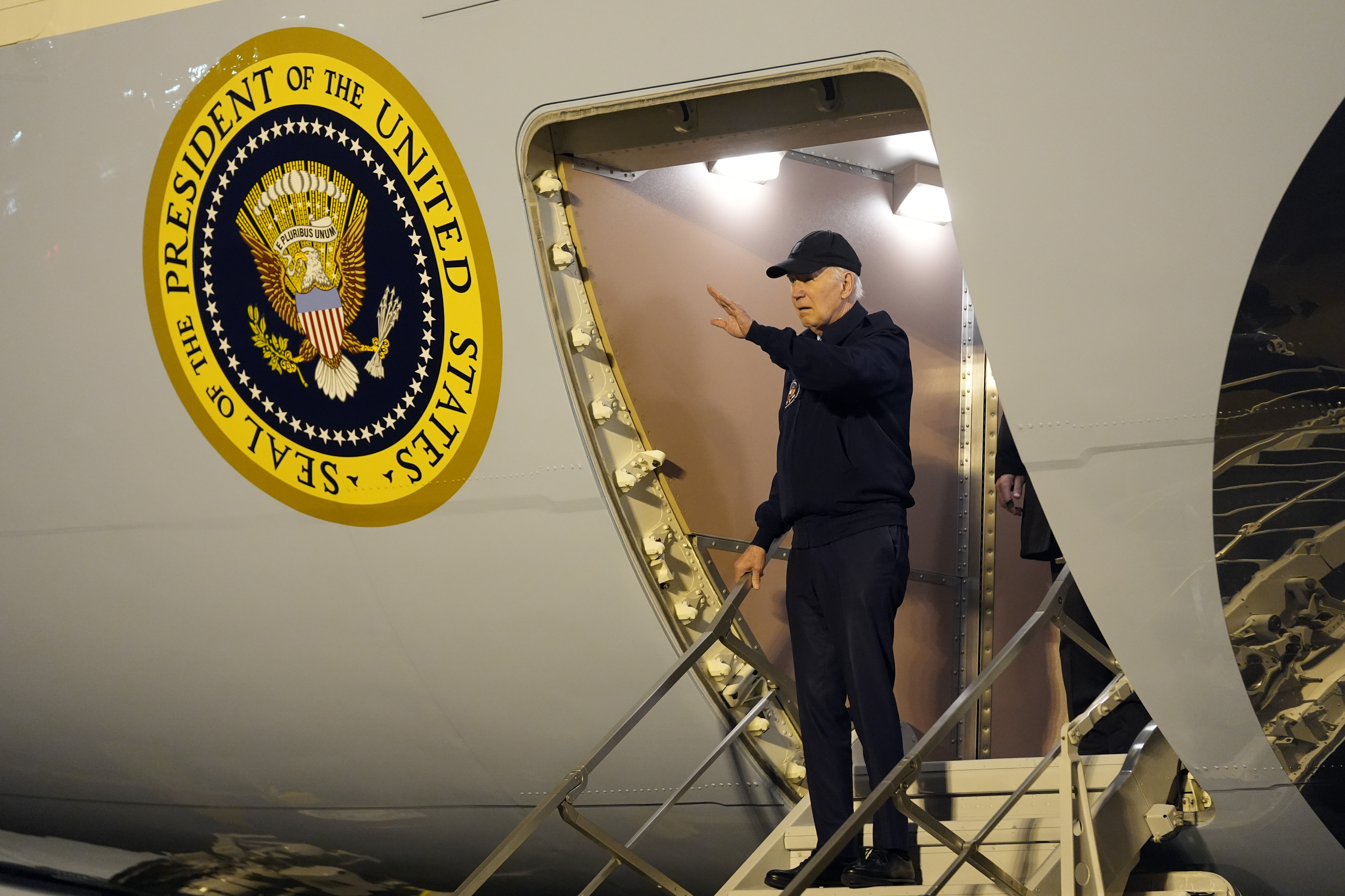 President Joe Biden walks down the steps of Air Force One at Dover Air Force Base in Delaware, Wednesday, July 17, 2024. Biden is returning to his home in Rehoboth Beach, Del., to self-isolate after testing positive for COVID-19. (AP Photo/Susan Walsh)