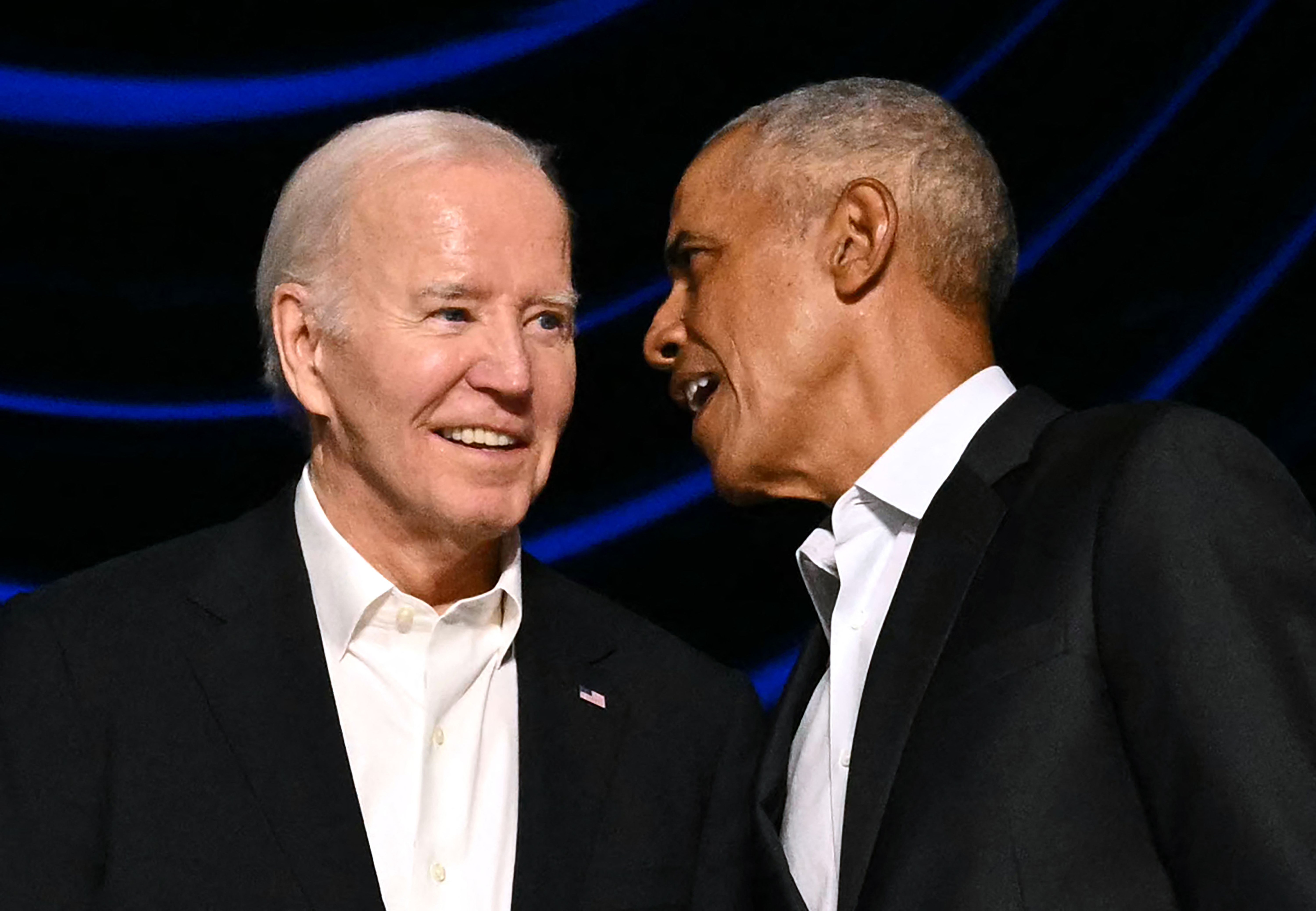 (FILES) US President Joe Biden (L) and former US President Barack Obama attend a campaign fundraiser at the Peacock Theater in Los Angeles on June 15, 2024. Former US president Barack Obama has told allies that Joe Biden needs to reconsider his reelection bid, the Washington Post reported on July 18, 2024. Obama believes that Biden's path to victory has diminished and that the 81-year-old should "seriously consider the viability of his candidacy," the newspaper said, citing people briefed on his thinking. (Photo by Mandel NGAN / AFP)
