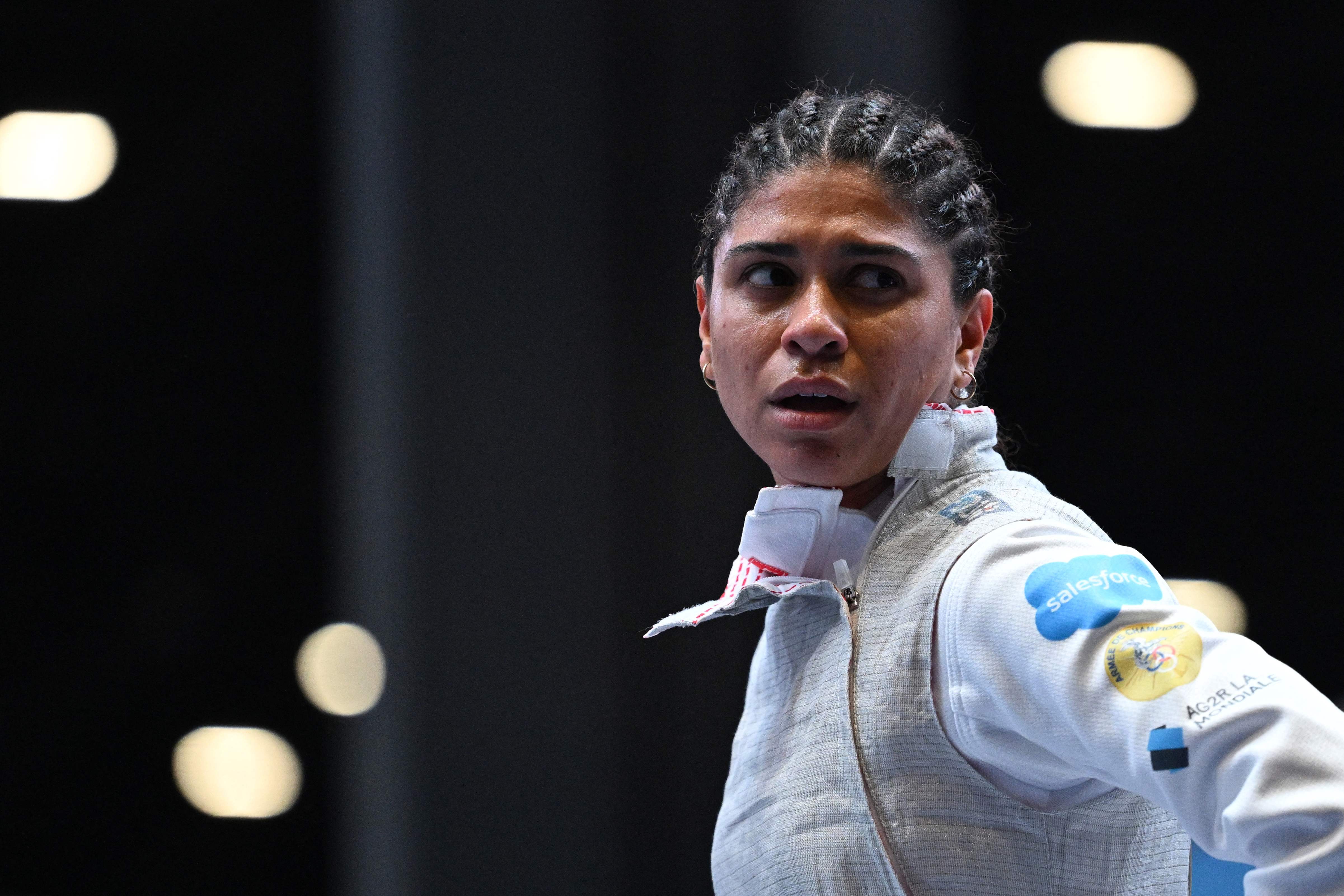 (FILES) France's Ysaora Thibus looks on during during the Foil Women's Senior Individual qualifiers as part of the FIE Fencing World Championships at the Fair Allianz MI.CO (Milano Convegni) in Milan, on July 26, 2023. French foilist Ysaora Thibus was tested positive during an anti-doping check and suspended. (Photo by Andreas SOLARO / AFP)